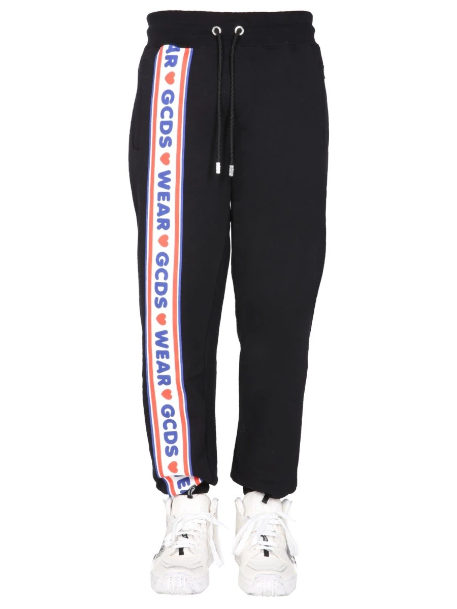 JOGGING PANTS WITH "CUTE TAPE" LOGO BAND.webp