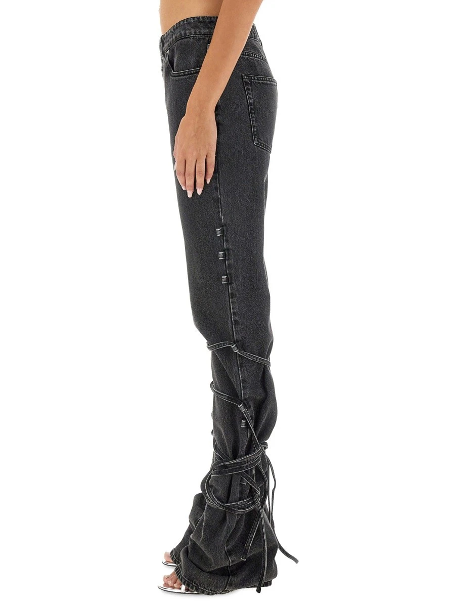 JEANS WITH KNOTTED DETAIL.webp