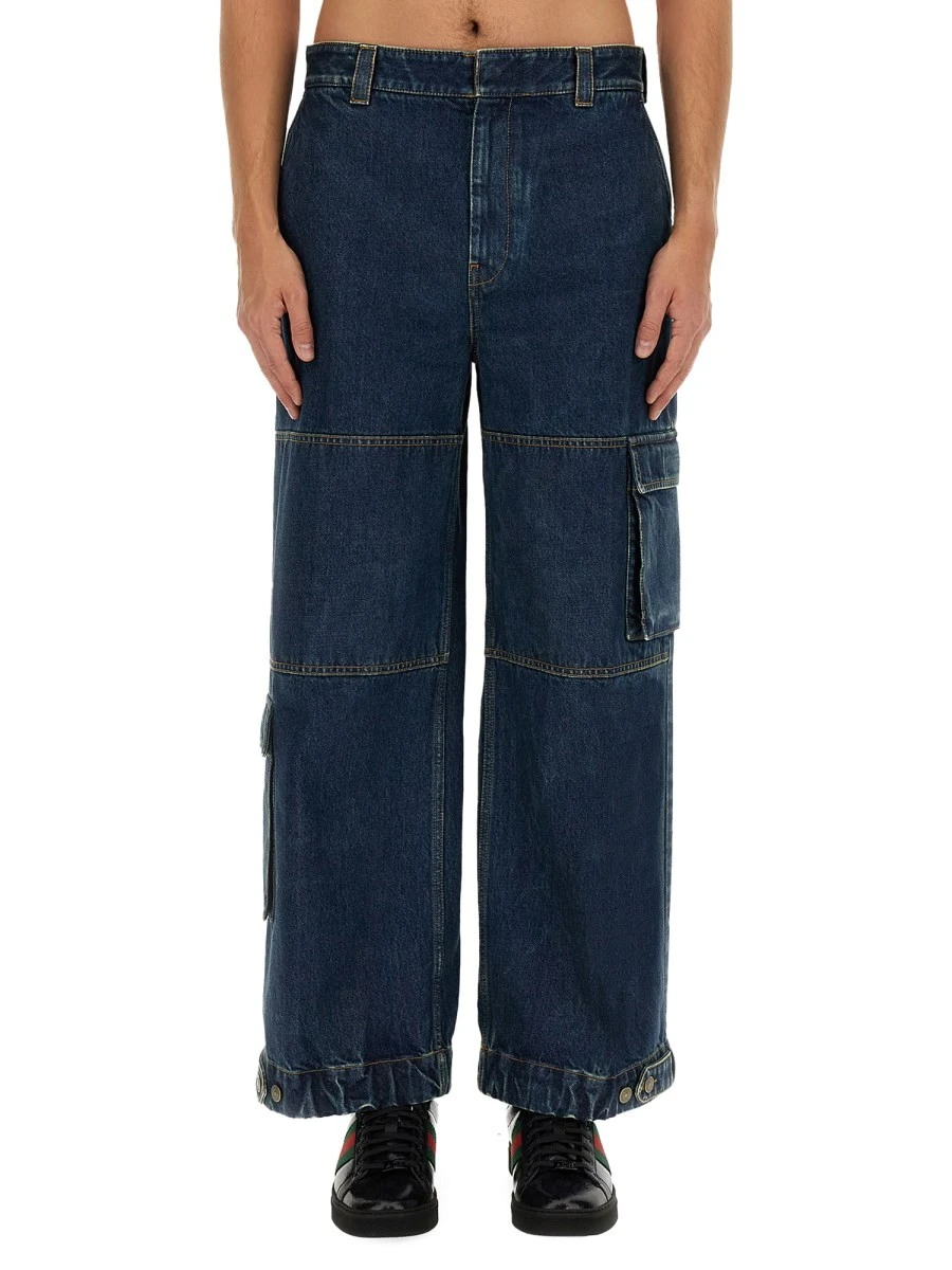 DENIM PANTS WITH GUCCI LABEL.webp