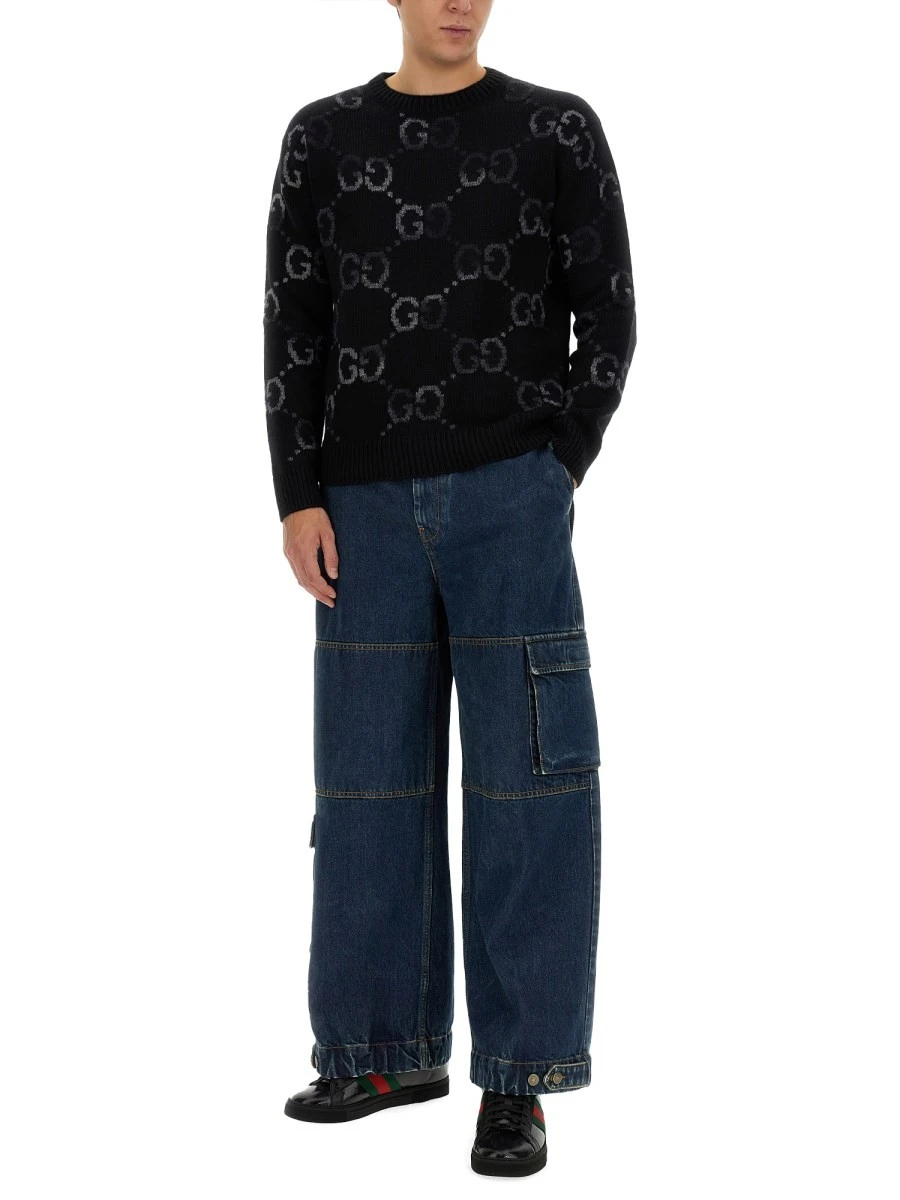 DENIM PANTS WITH GUCCI LABEL.webp