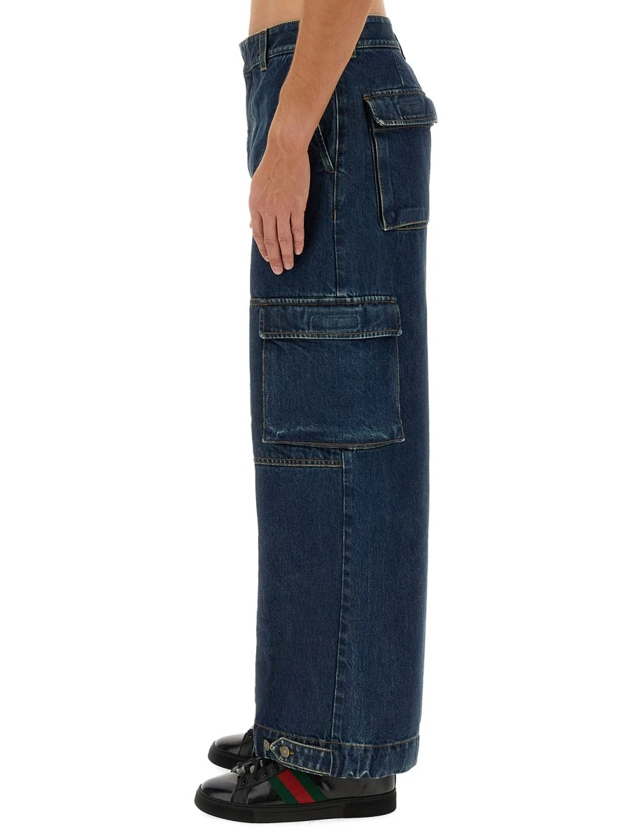 DENIM PANTS WITH GUCCI LABEL.webp