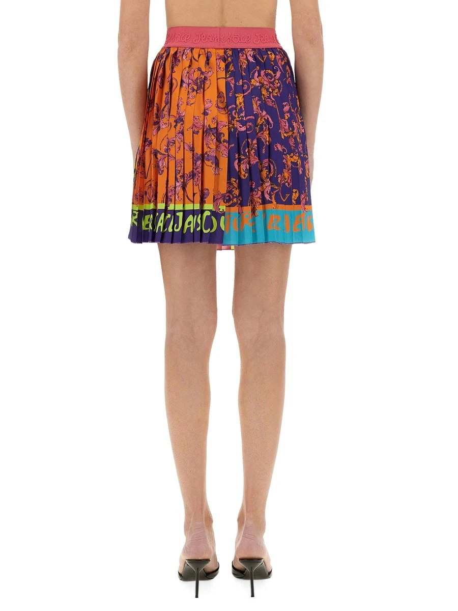 "OUTLINE BAROQUE" MINI PLEATED SKIRT.webp