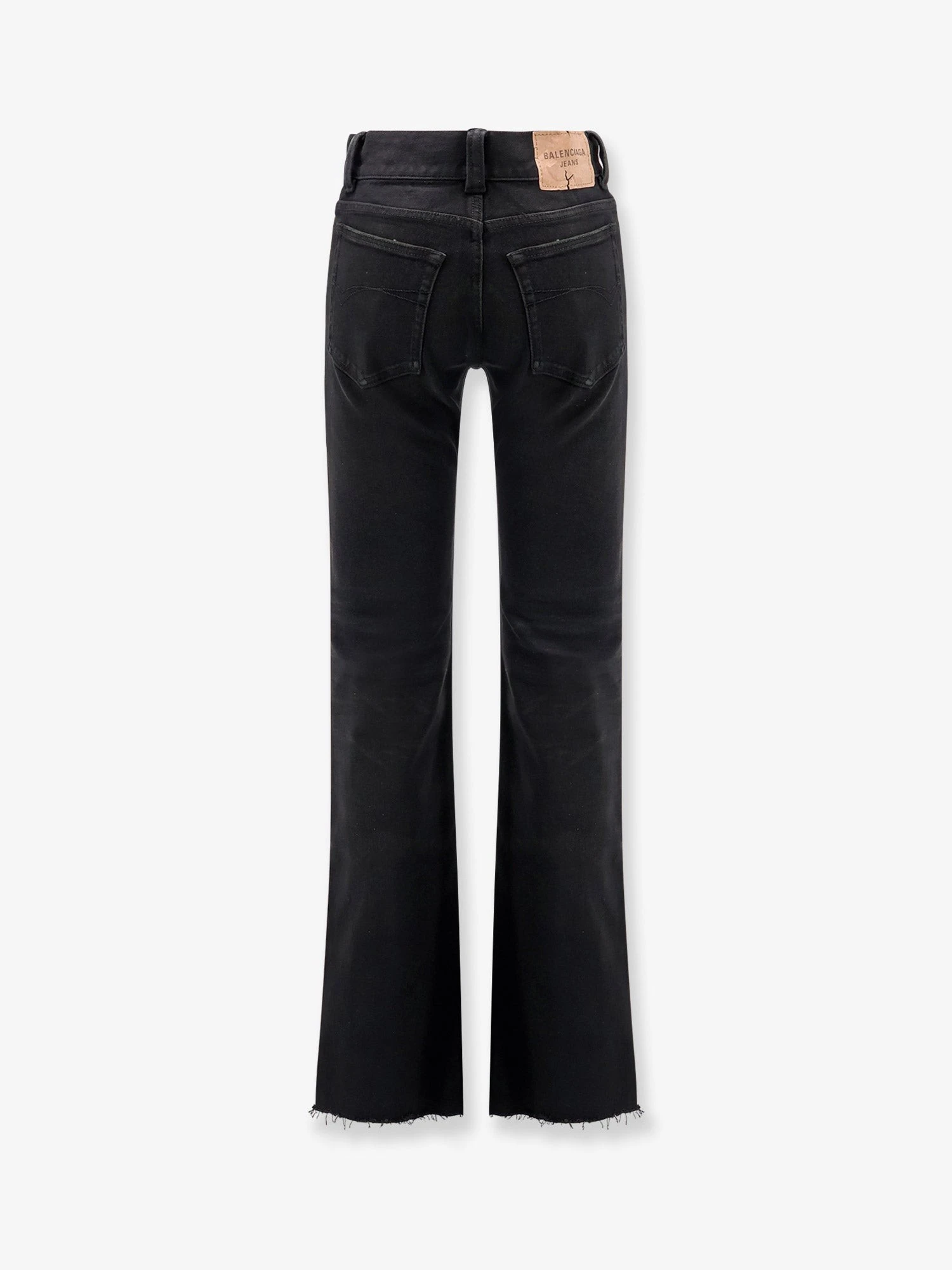 Denim trousers with frayed edges.webp