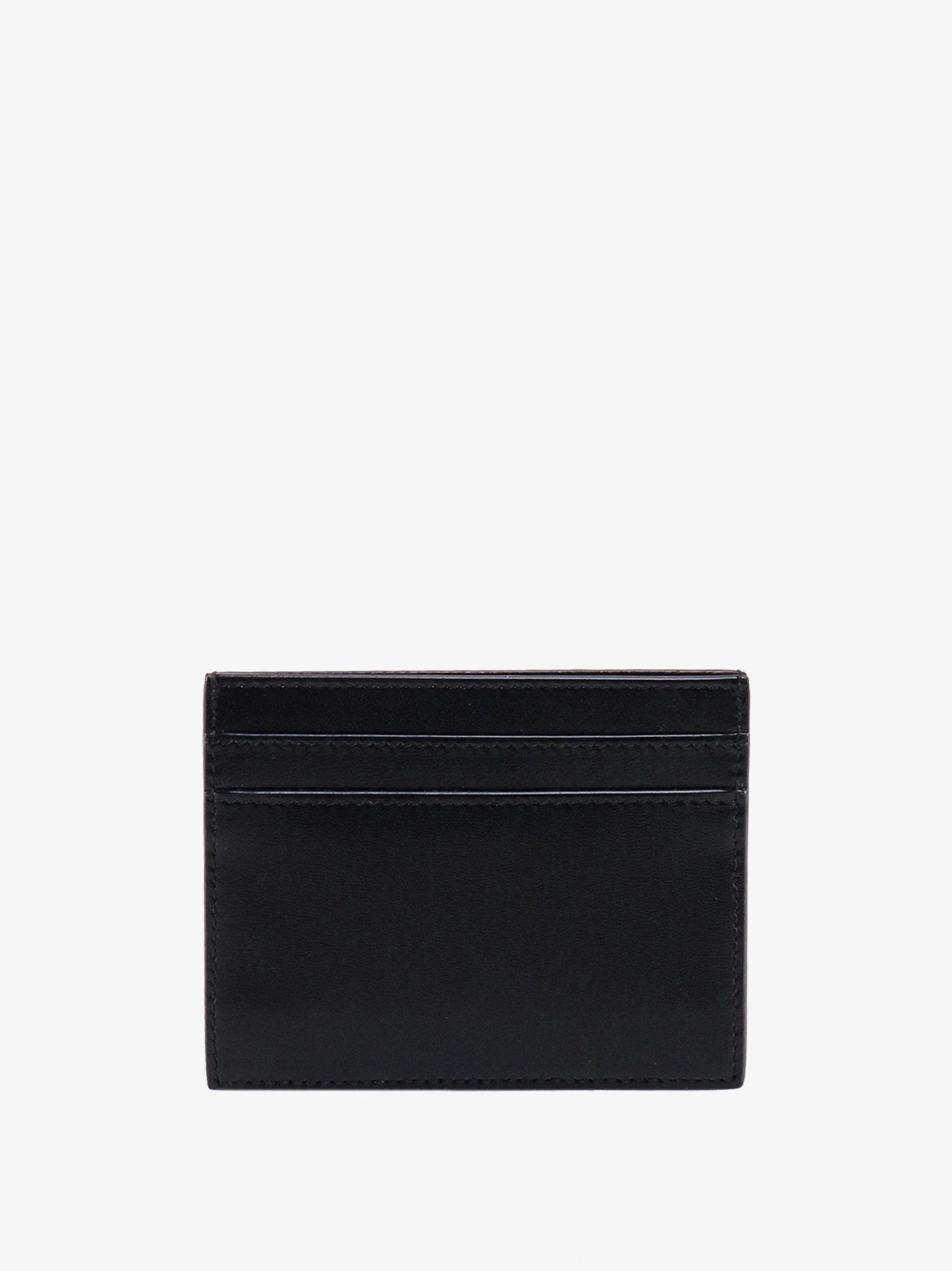 Leather card holder with frontal monogram.webp