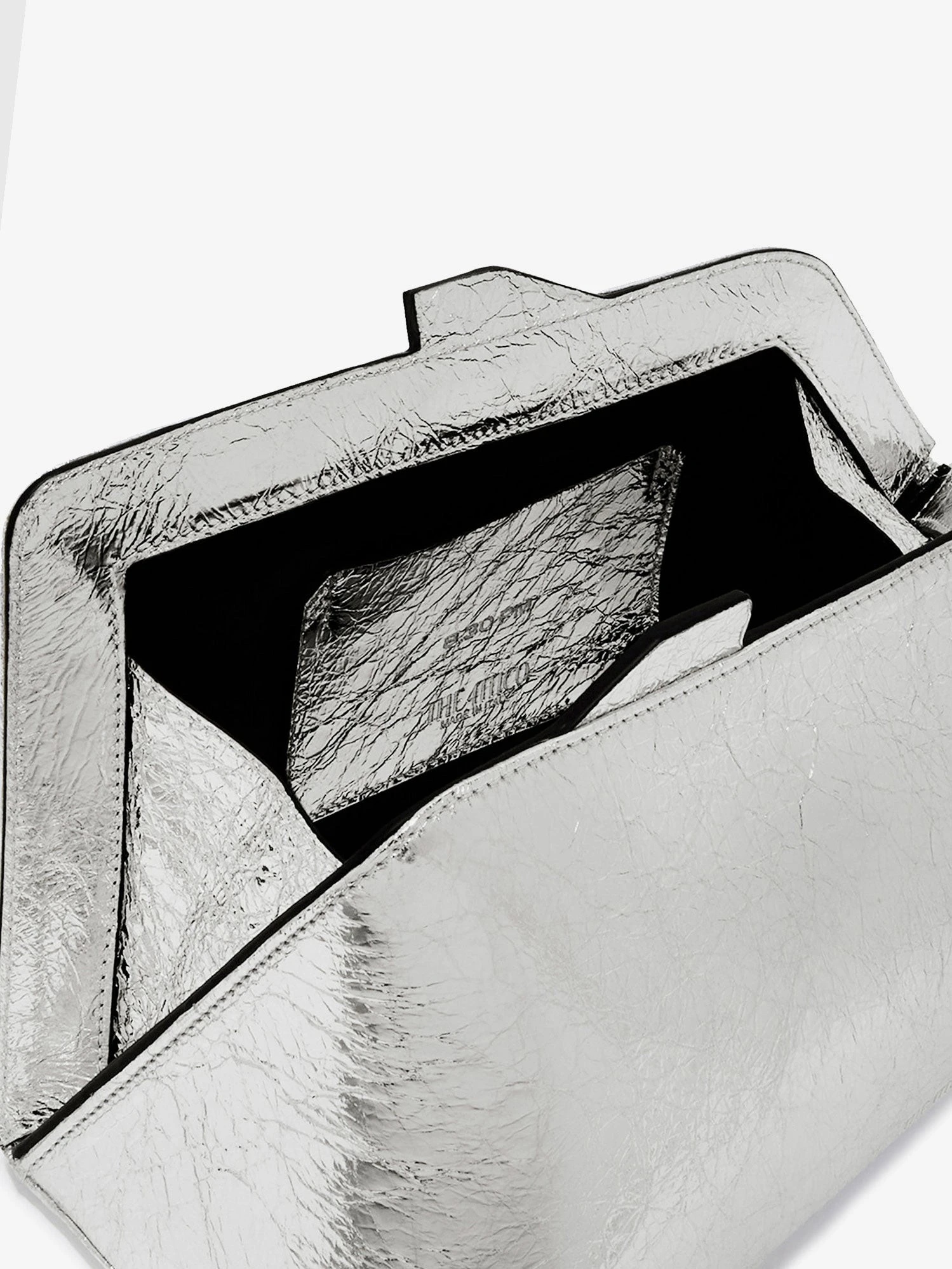 8.30 PM laminated leather clutch bag with logo engraved on the bottom.webp