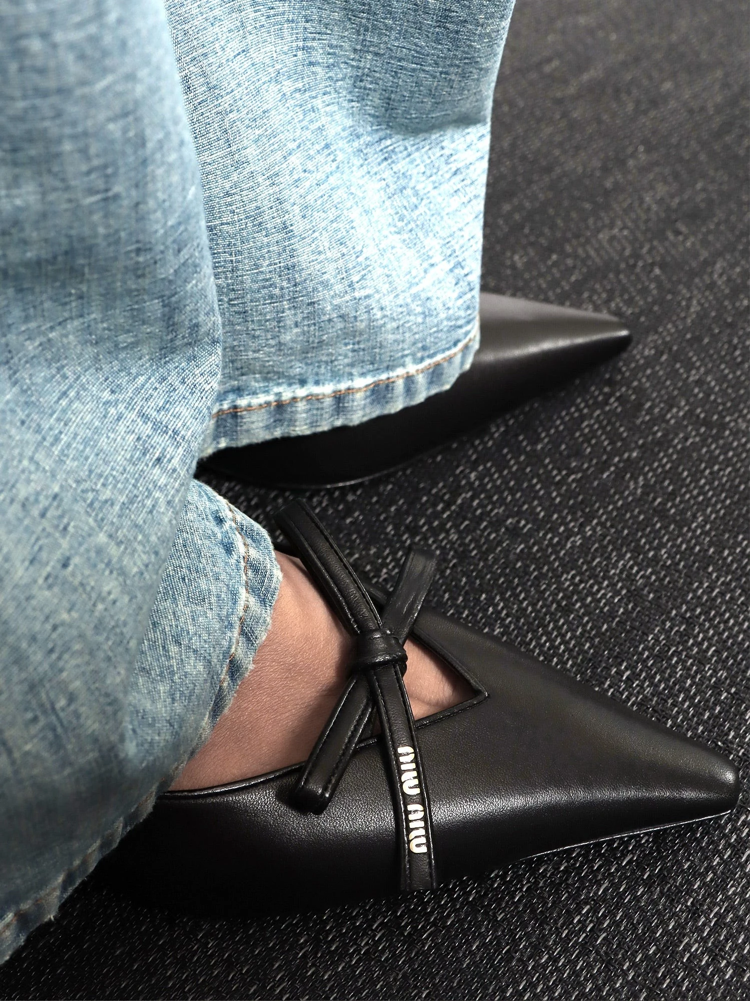 Leather décolleté with logo bow detail.webp