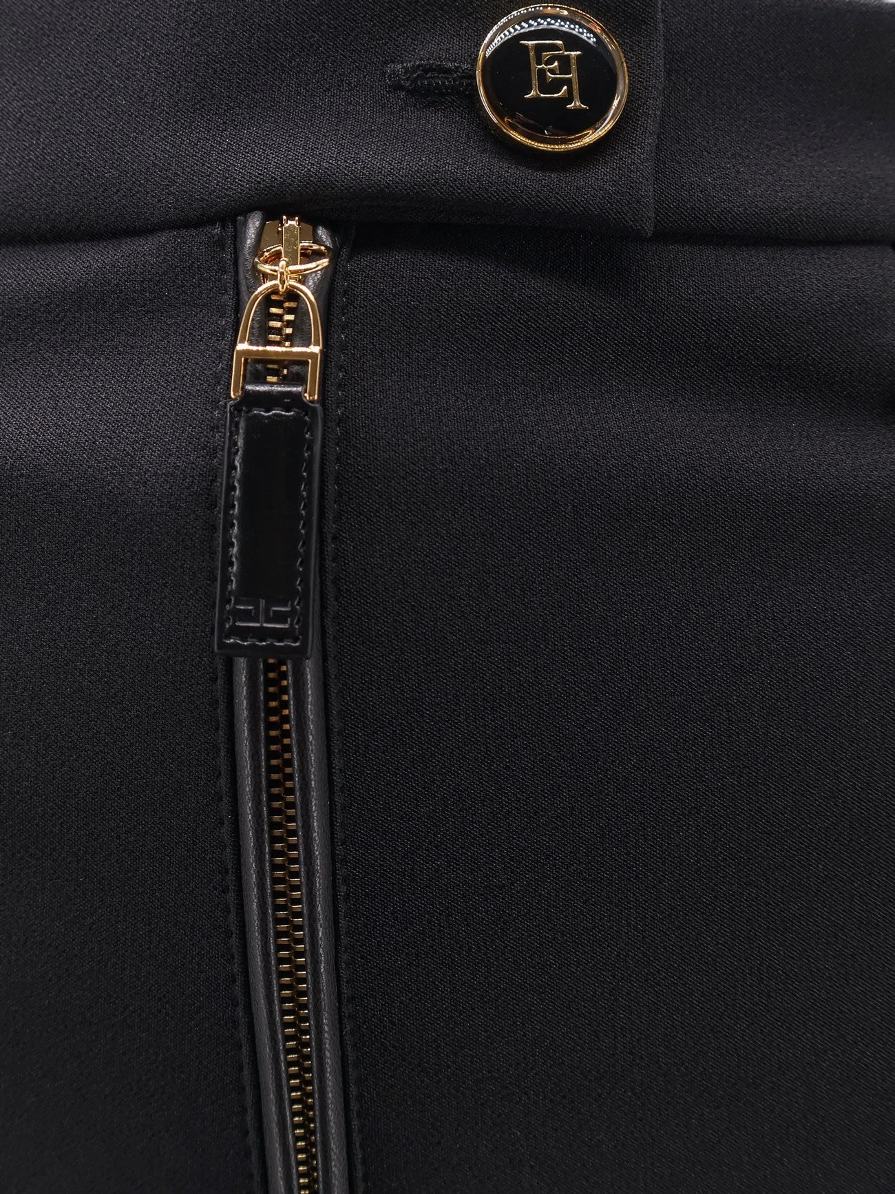 Trousers with logoed button.webp