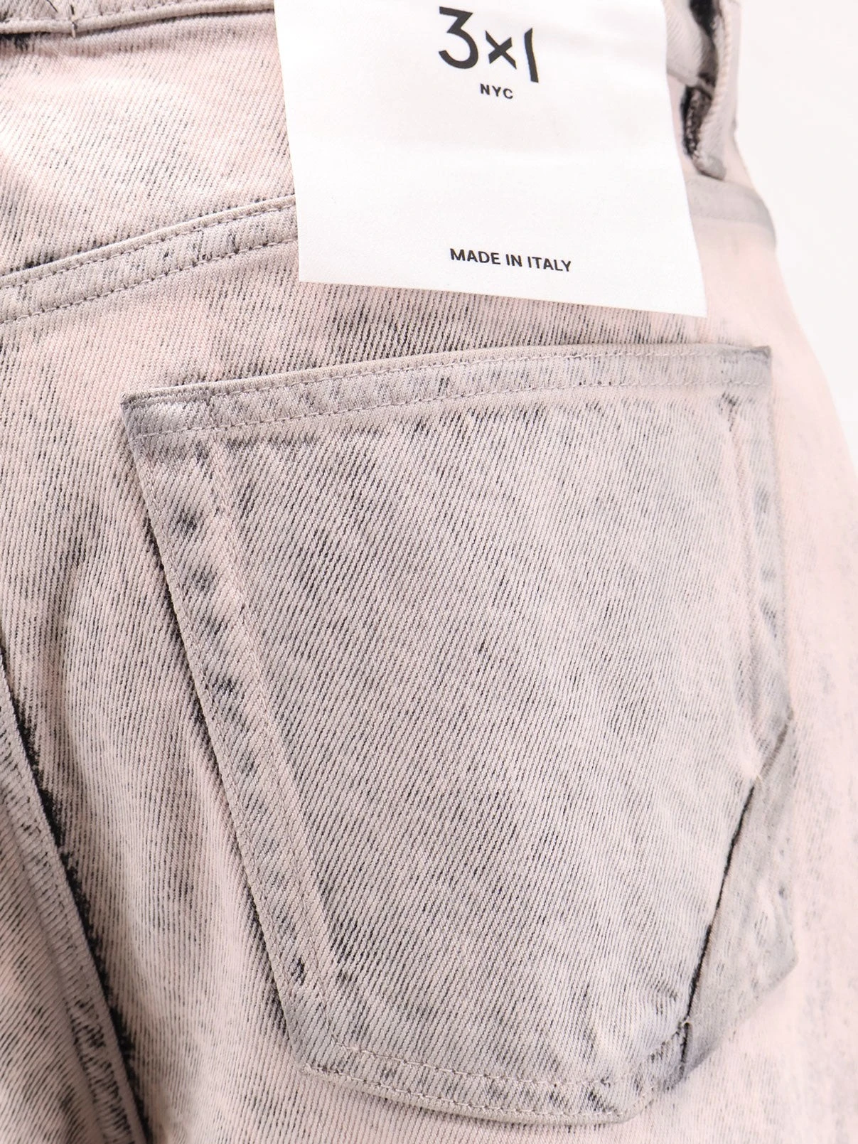 Denim jeans with bleached pattern.webp