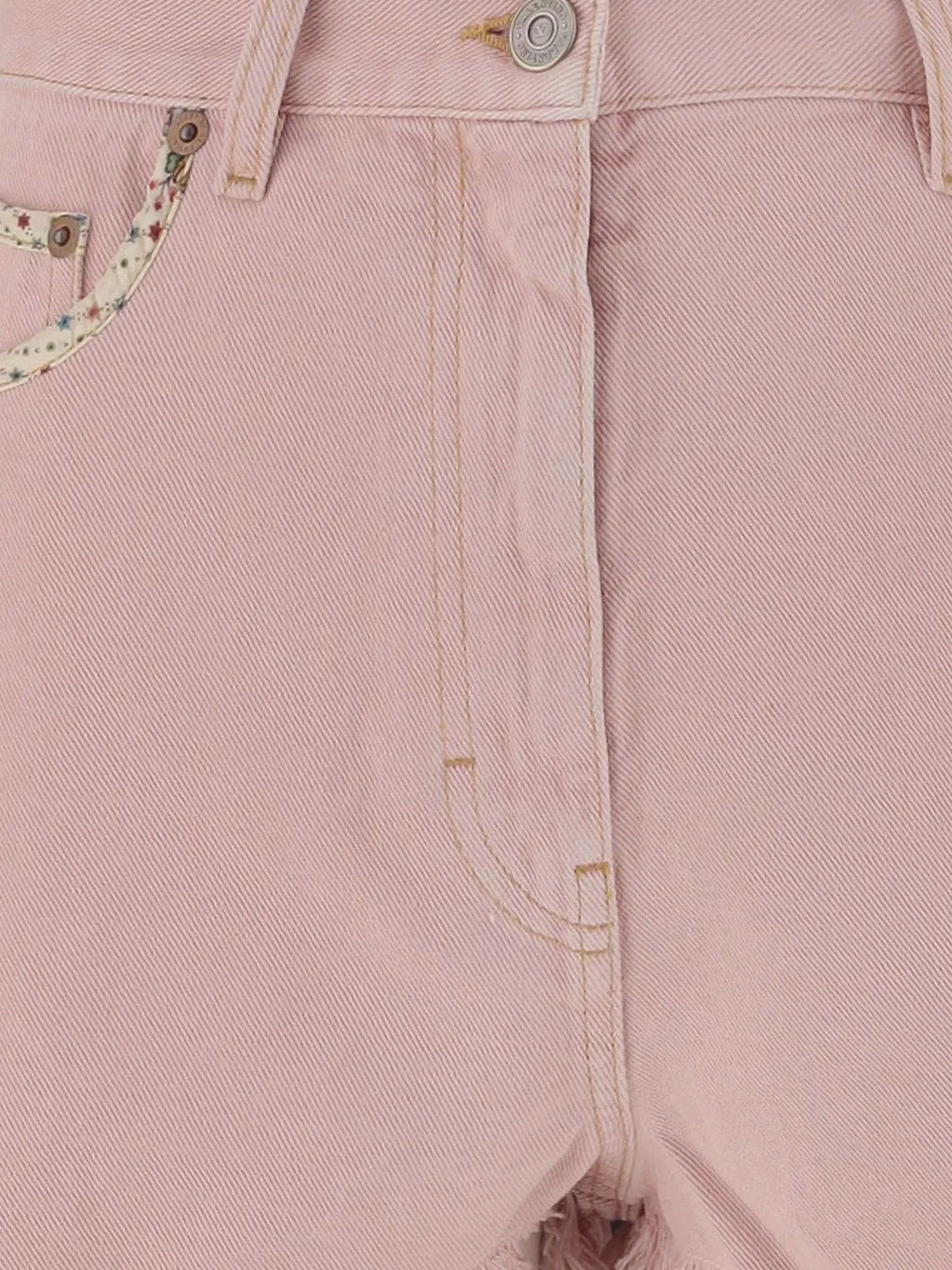 Denim shorts with frayed edges.webp