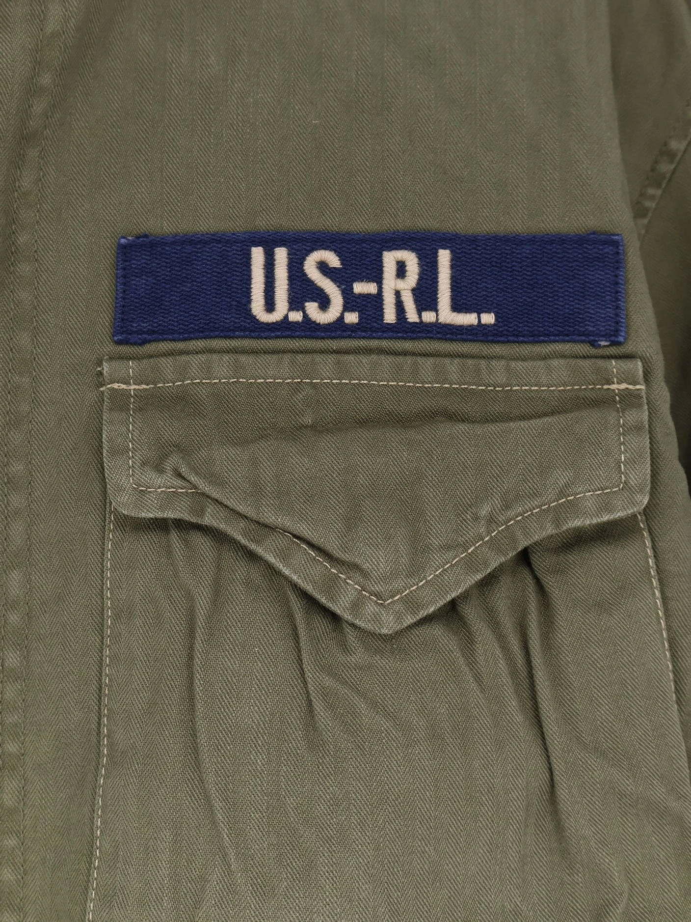 Cotton denim jacket with front logo patch.webp