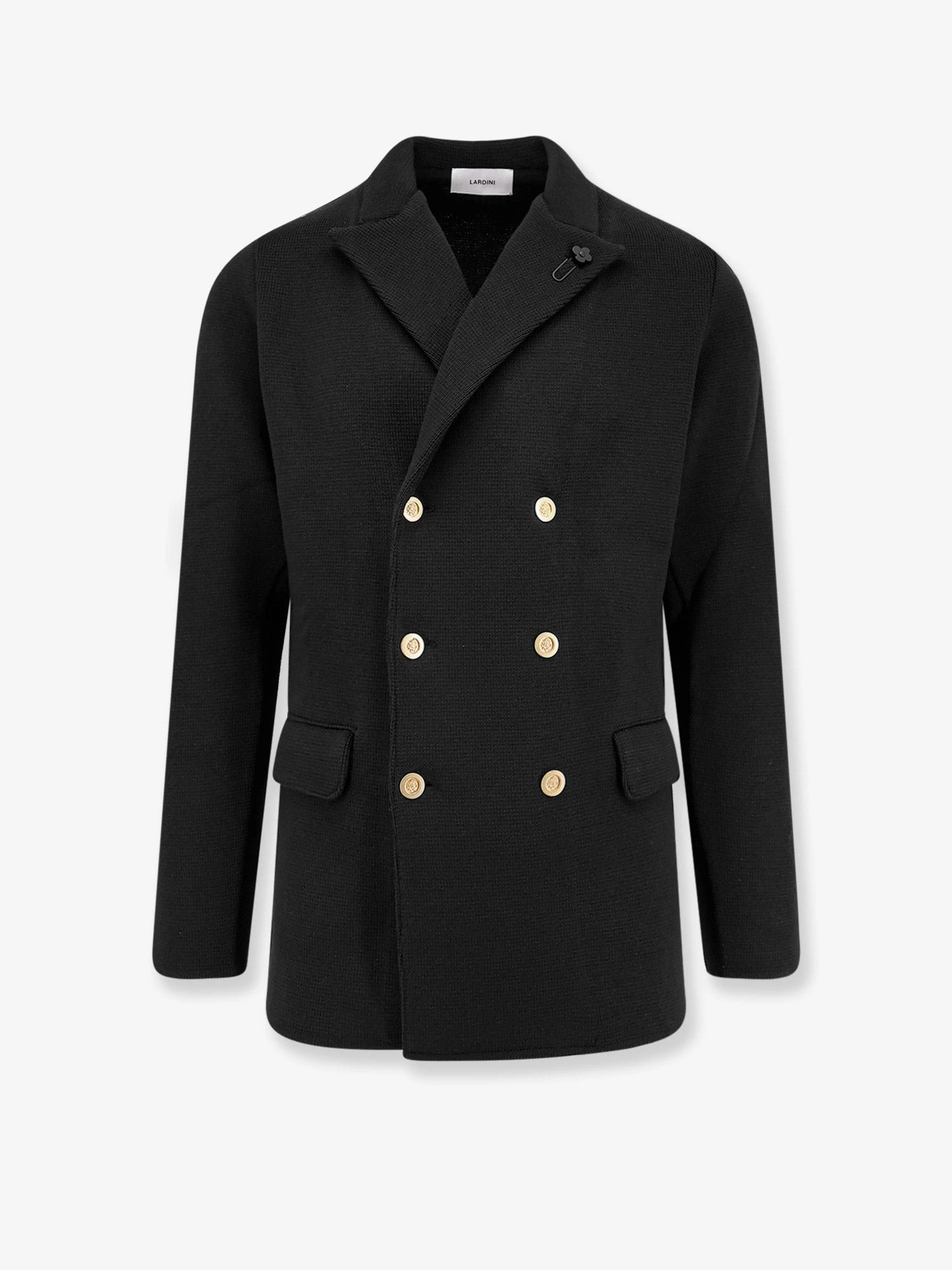 Knitted blazer with iconic brooch.webp