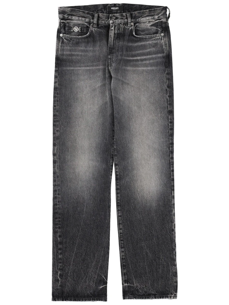 JEANS WITH "MEDUSA" DETAIL.webp