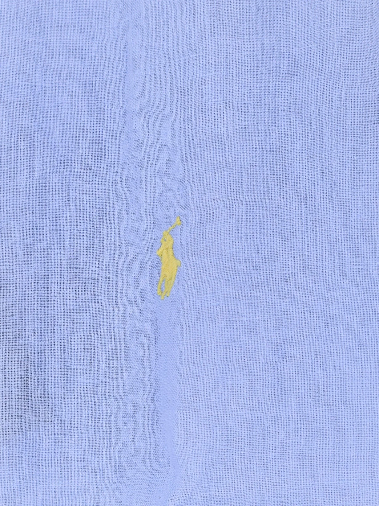 Linen shirt with embroidered logo on the front.webp