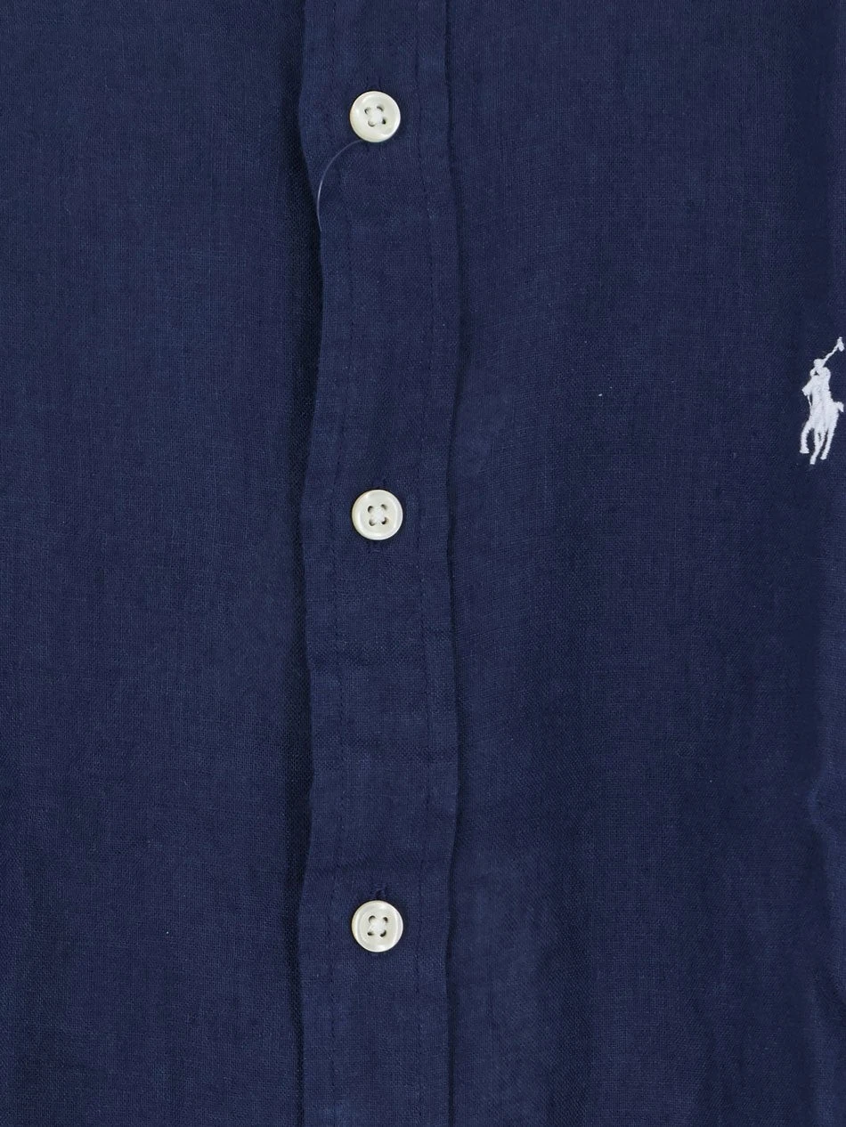 Linen shirt with embroidered logo on the front.webp
