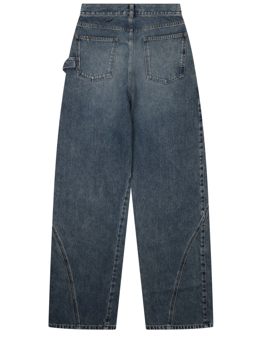 JEANS CON PATCH LOGO.webp