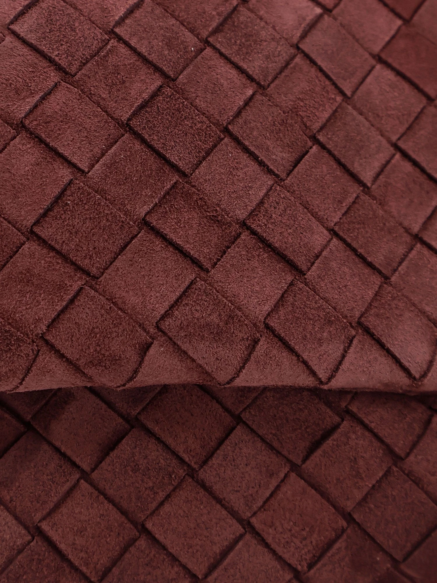 Suede Giorno crossbody bag with Intrecciato motif.webp