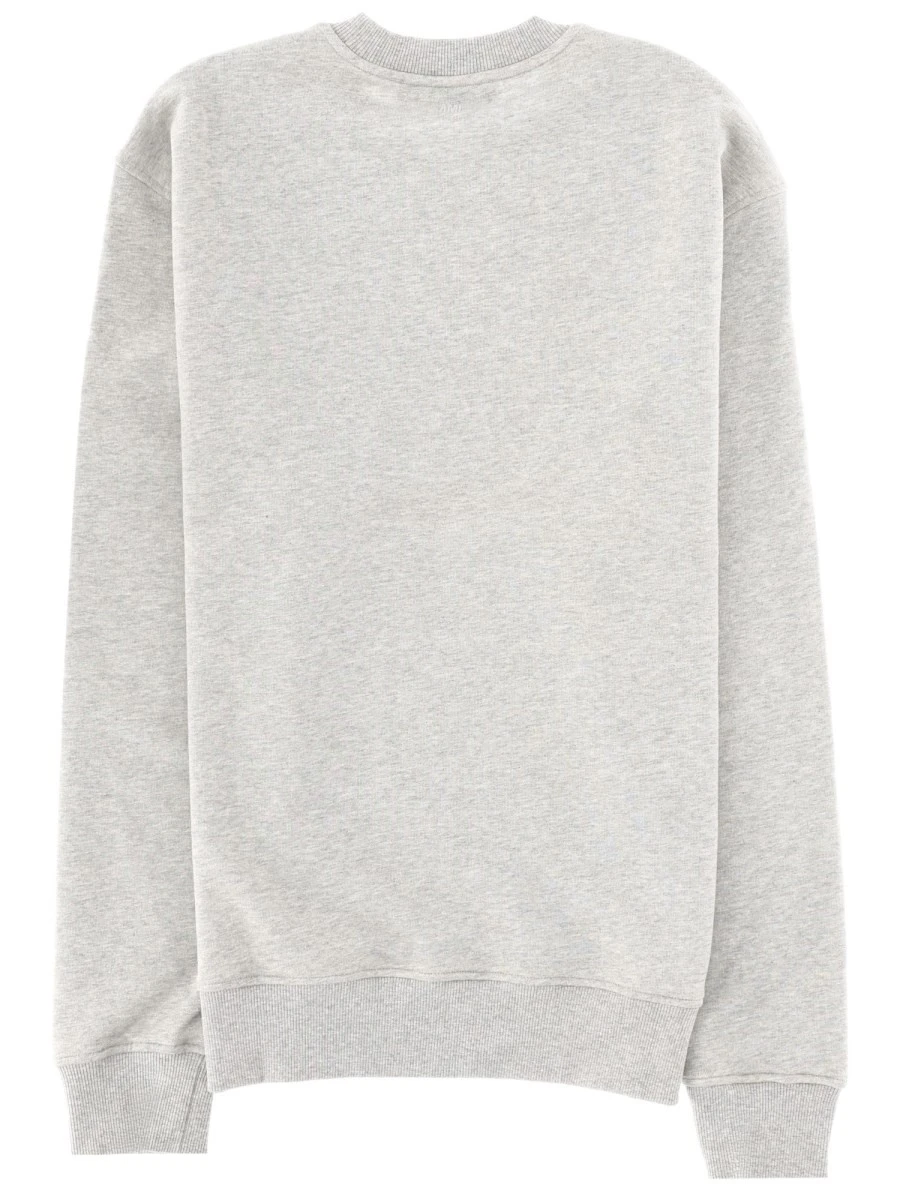 FELPA CON PATCH LOGO.webp