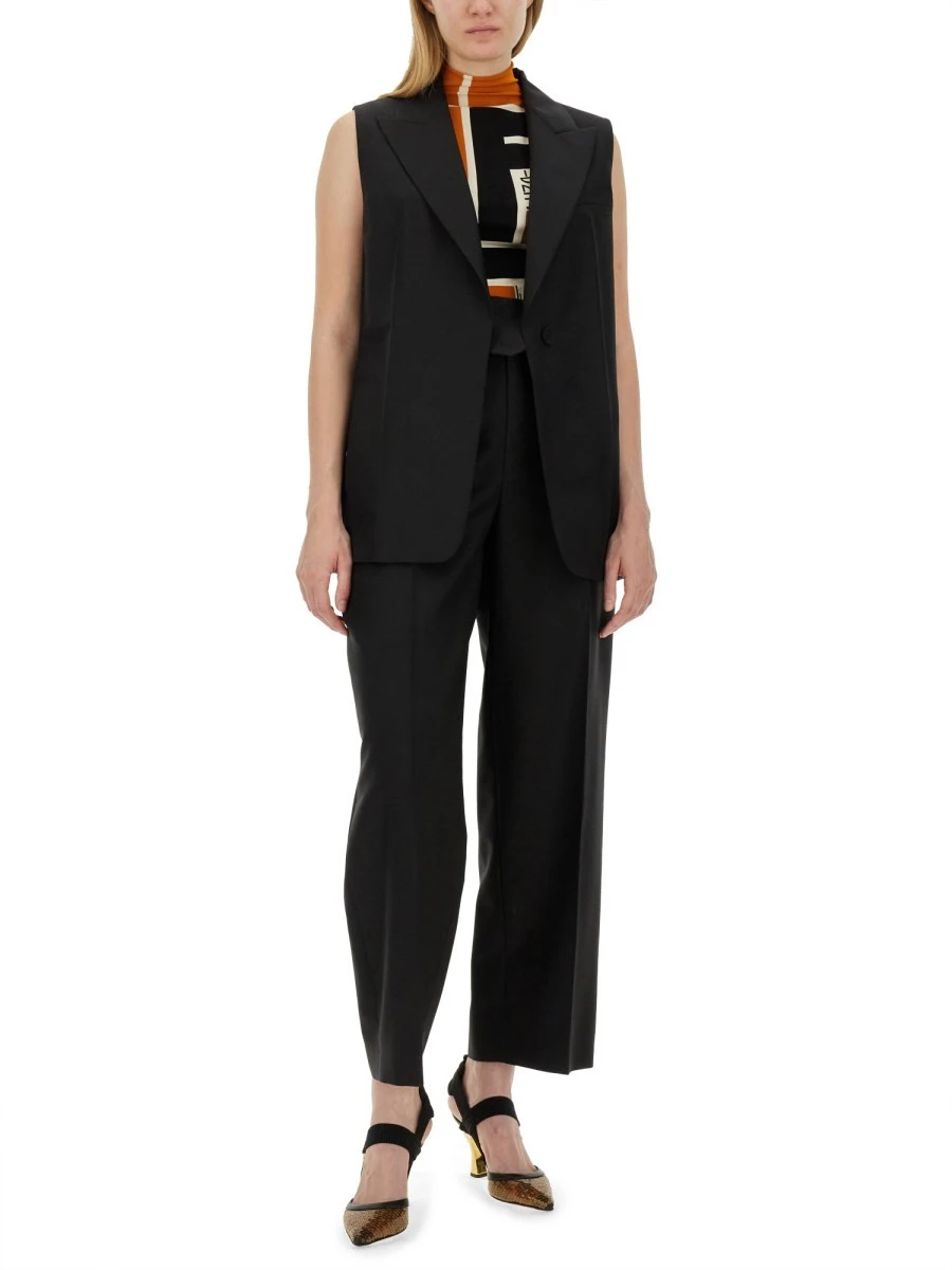 PANTS WITH ASYMMETRICAL WAIST.webp