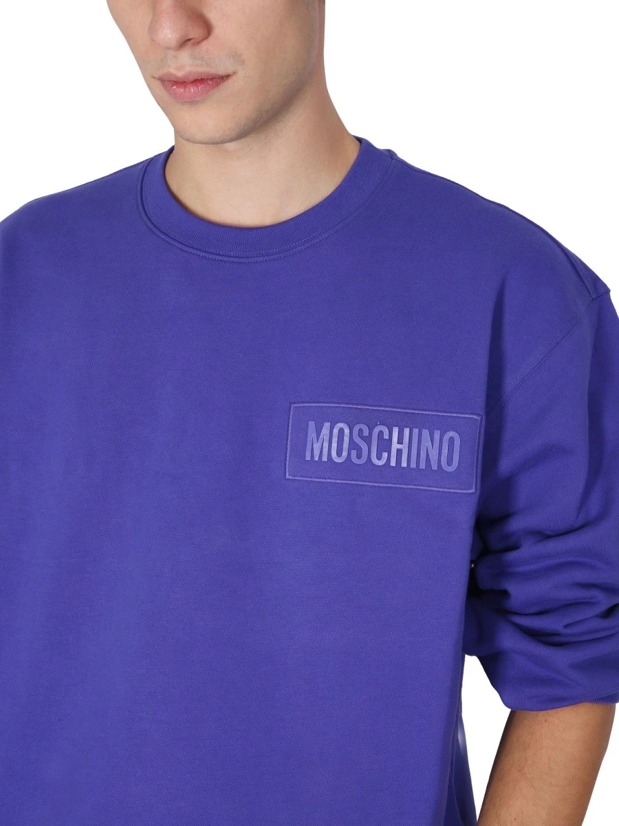 SWEATSHIRT WITH LOGO PATCH.webp