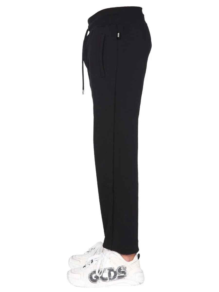 JOGGING PANTS WITH "CUTE TAPE" LOGO BAND.webp