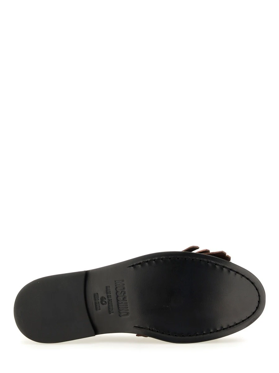 MOCCASIN WITH BANGS AND COIN.webp