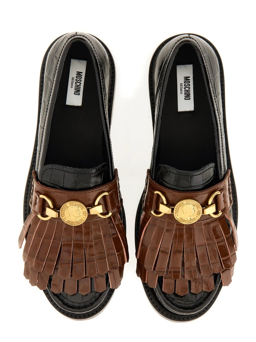 MOCCASIN WITH BANGS AND COIN.webp