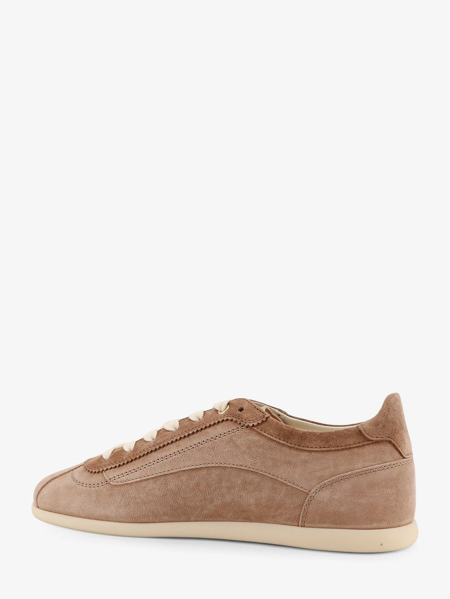 Leather sneakers with stitching detail.webp