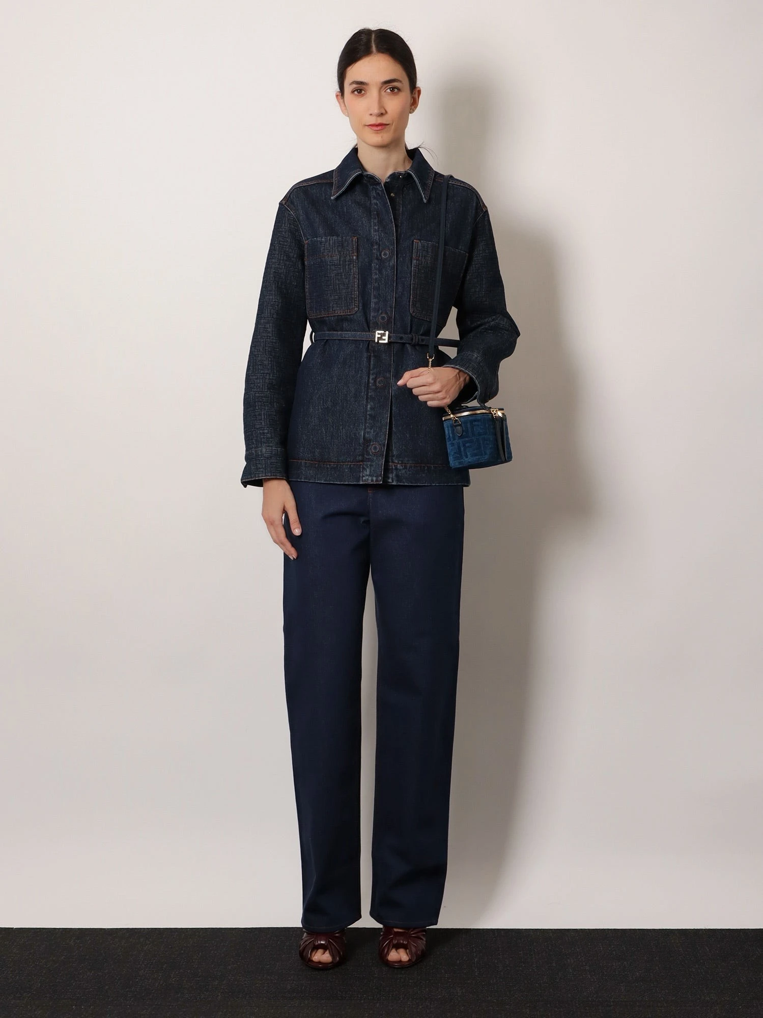 Blue denim jeans with FF detail on the bottom.webp