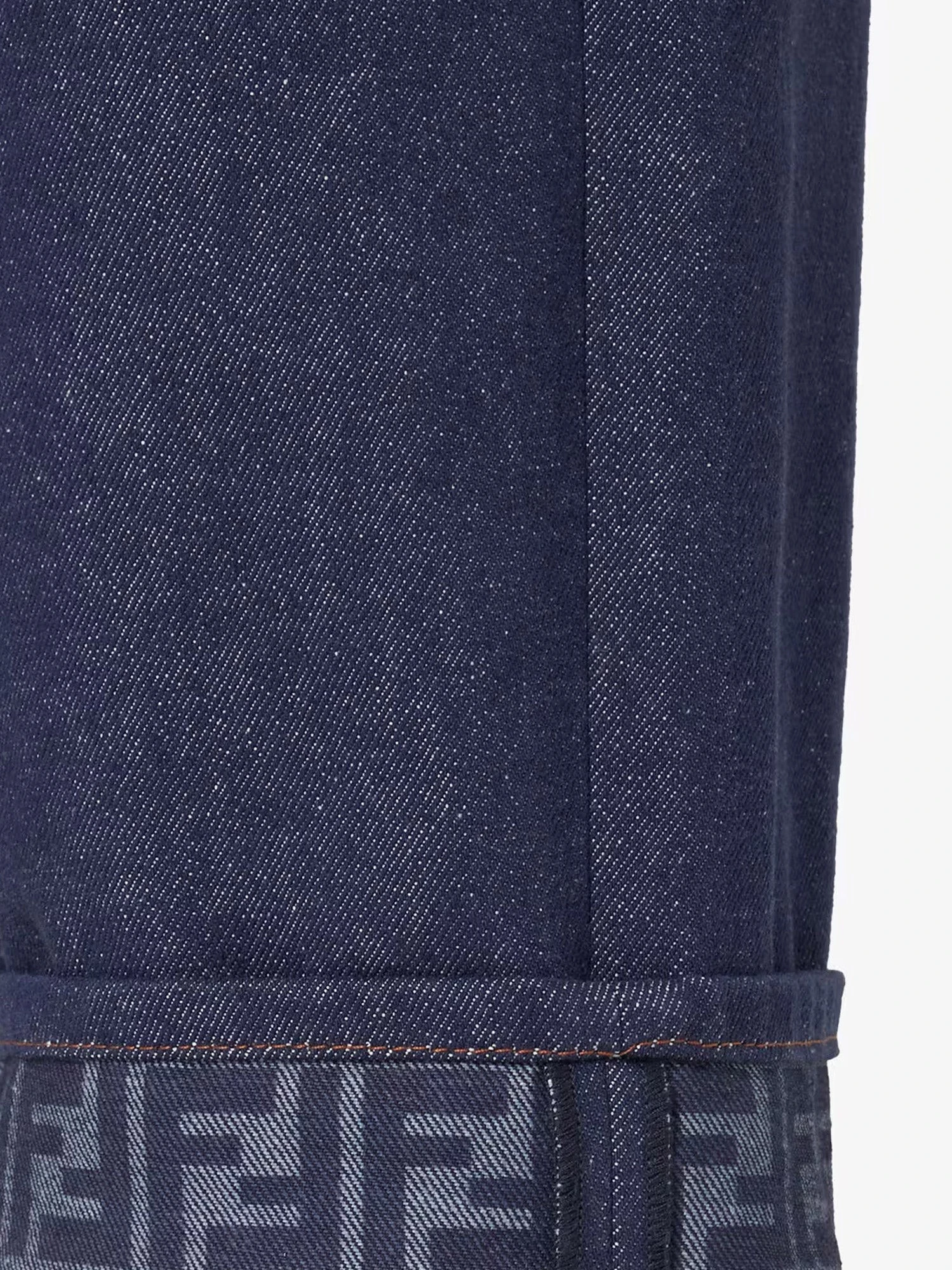 Blue denim jeans with FF detail on the bottom.webp