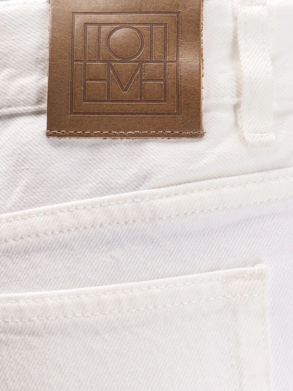 White denim trousers with flared bottom.webp