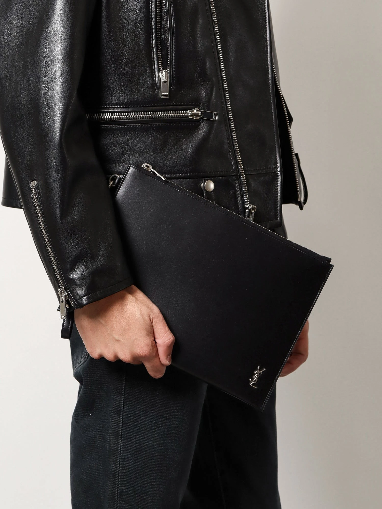 Leather clutch with Monogram detail.webp
