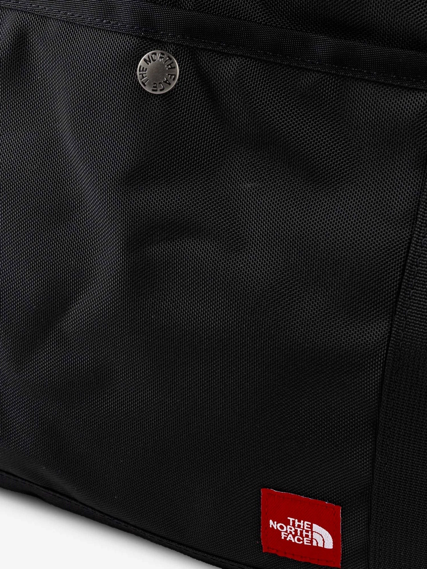 Nylon shoulder bag with logo label on the bottom.webp