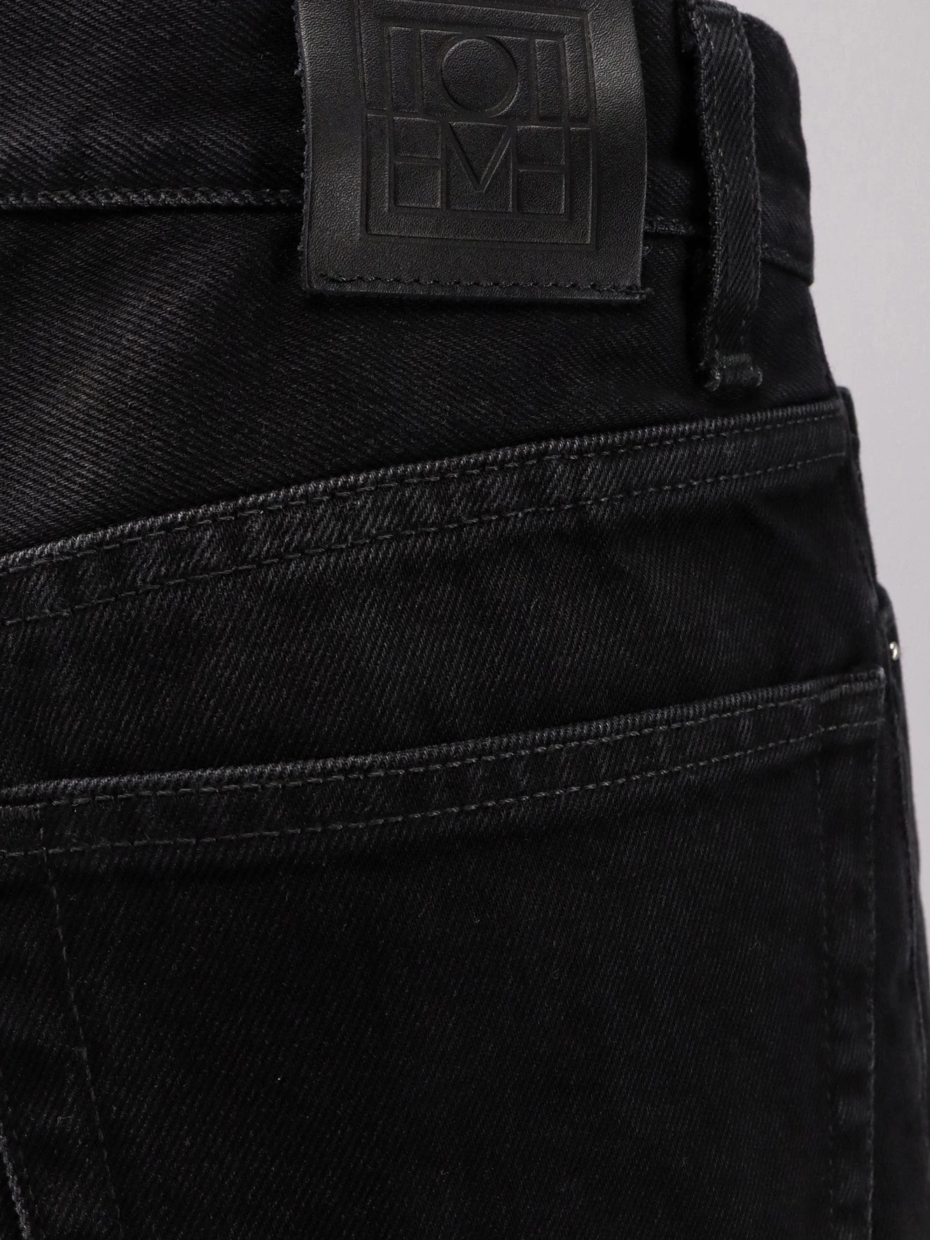 Black denim jeans.webp