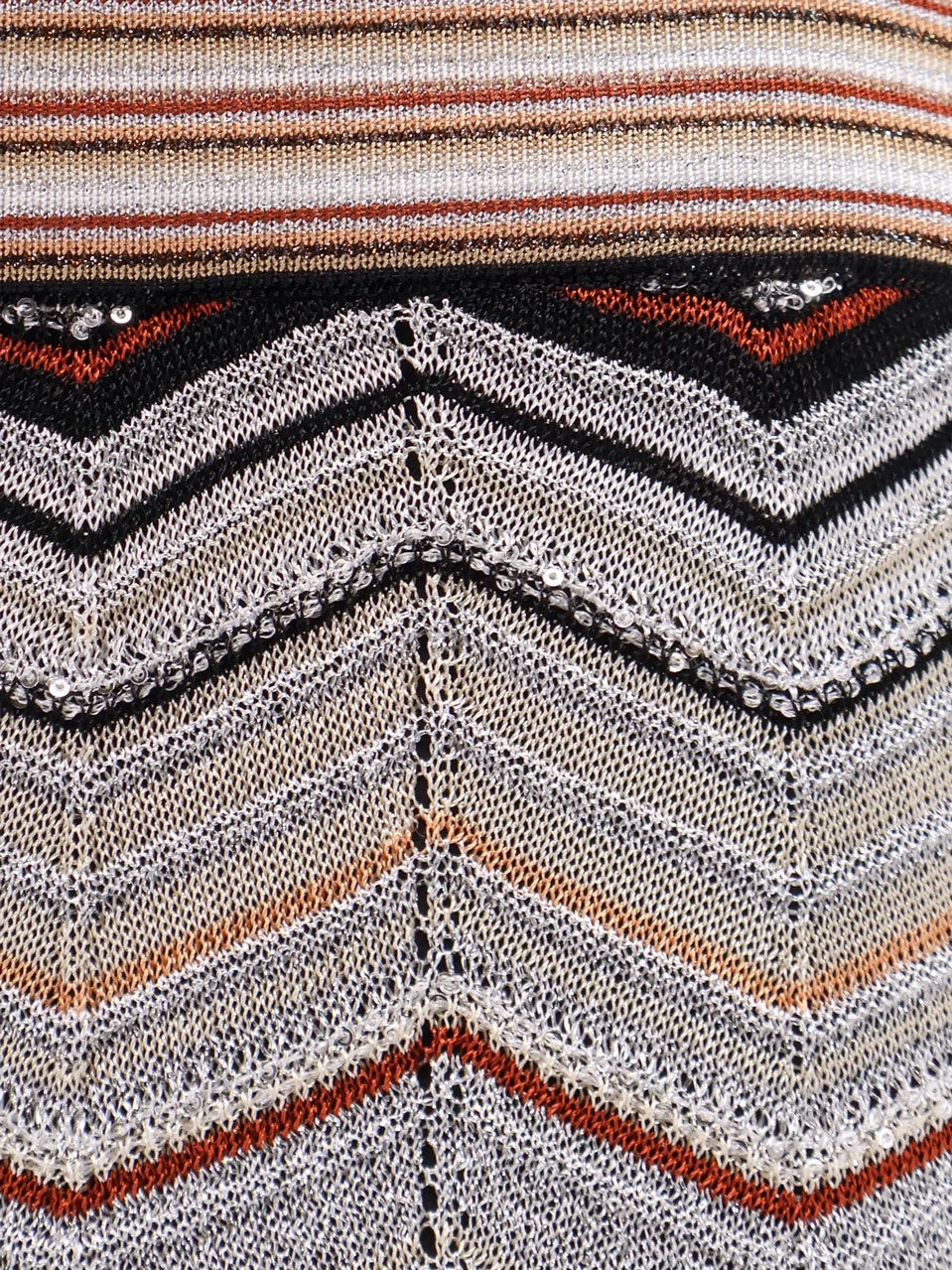 Viscose trousers with laminated chevron pattern.webp