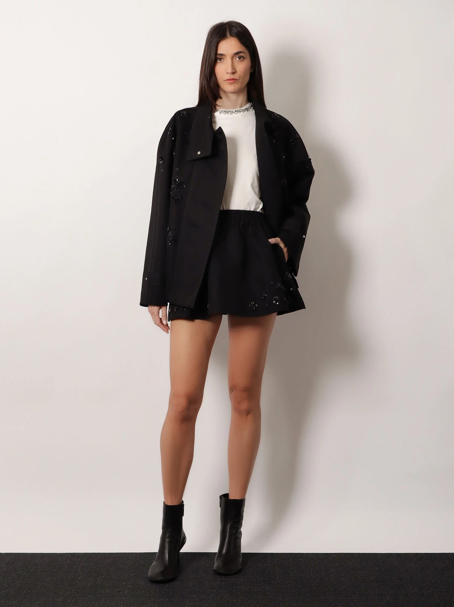 Black denim jacket with floral details in sequins and crystals.webp