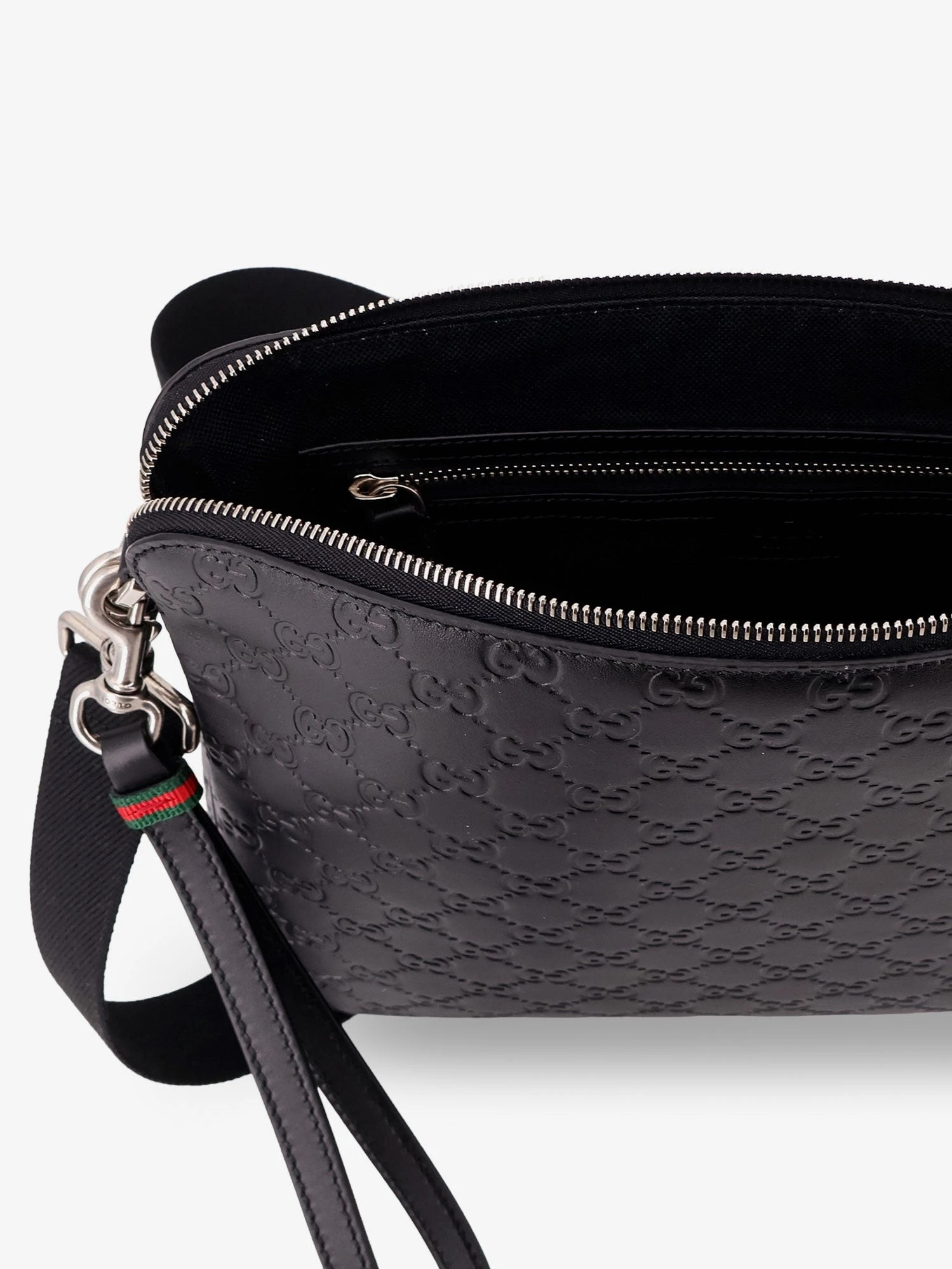Leather GG Emblem crossbody bag with embossed GG motif.webp