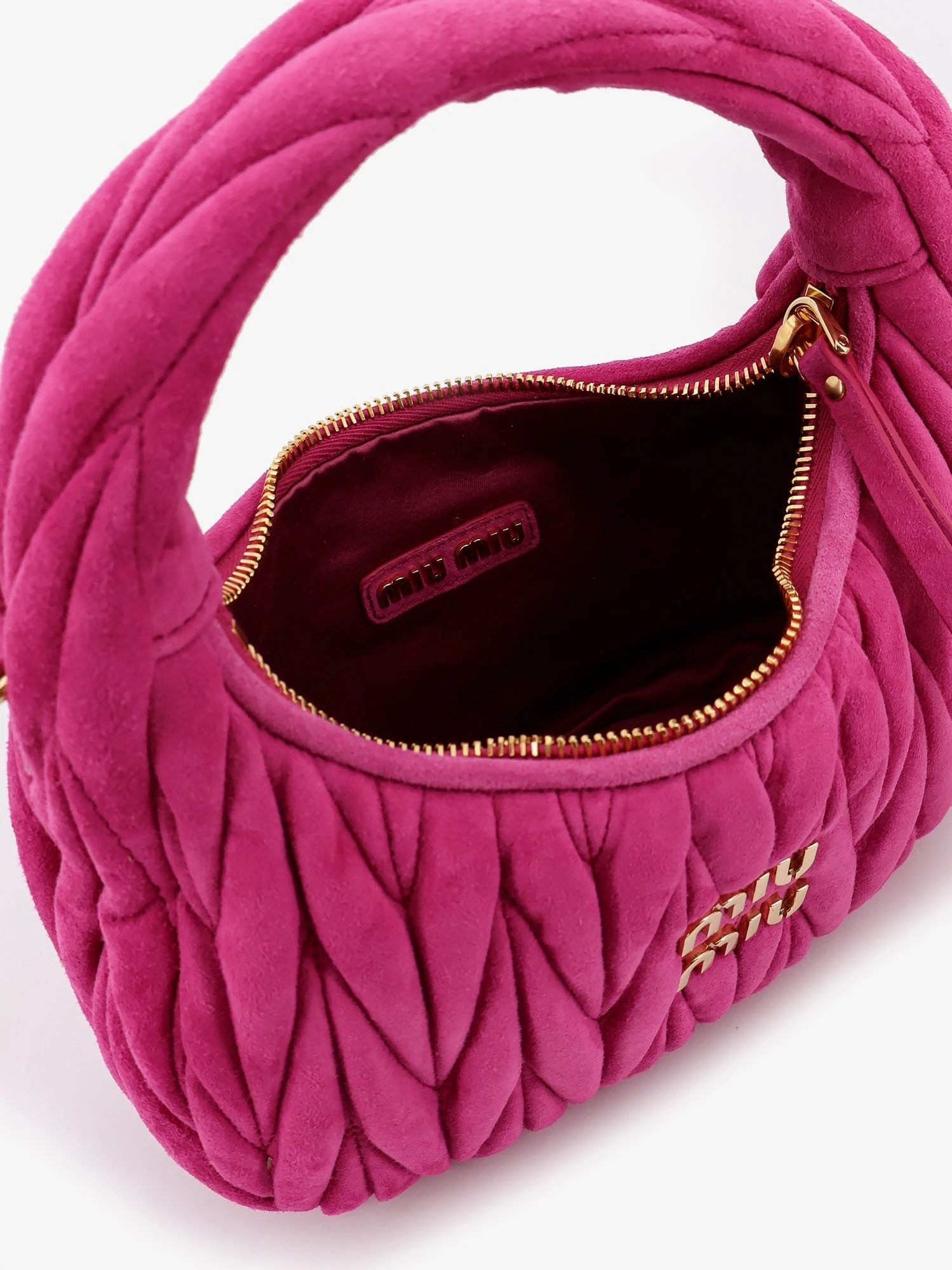 Wander matelassé suede shoulder bag.webp