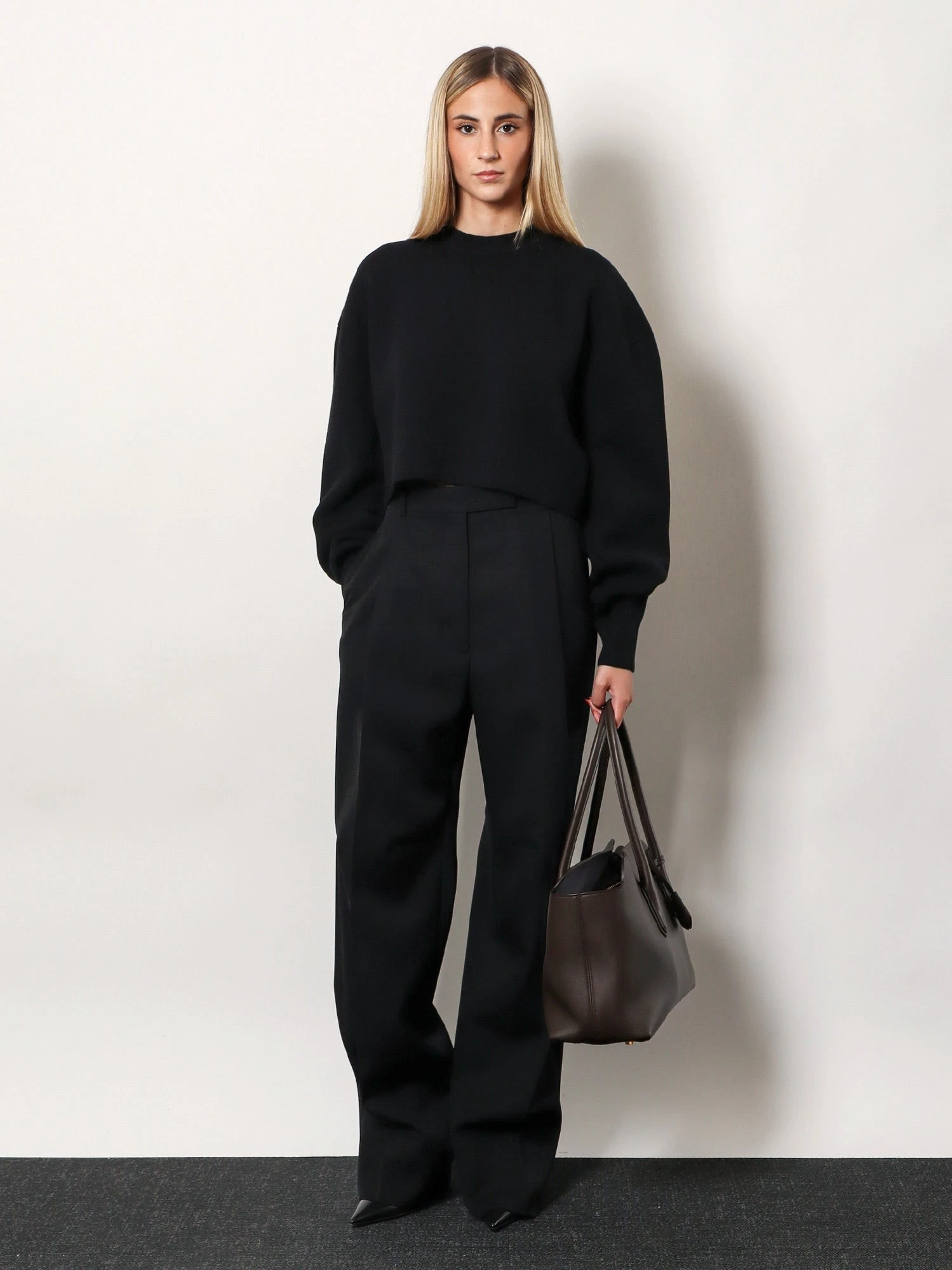 Pleated wool trousers.webp