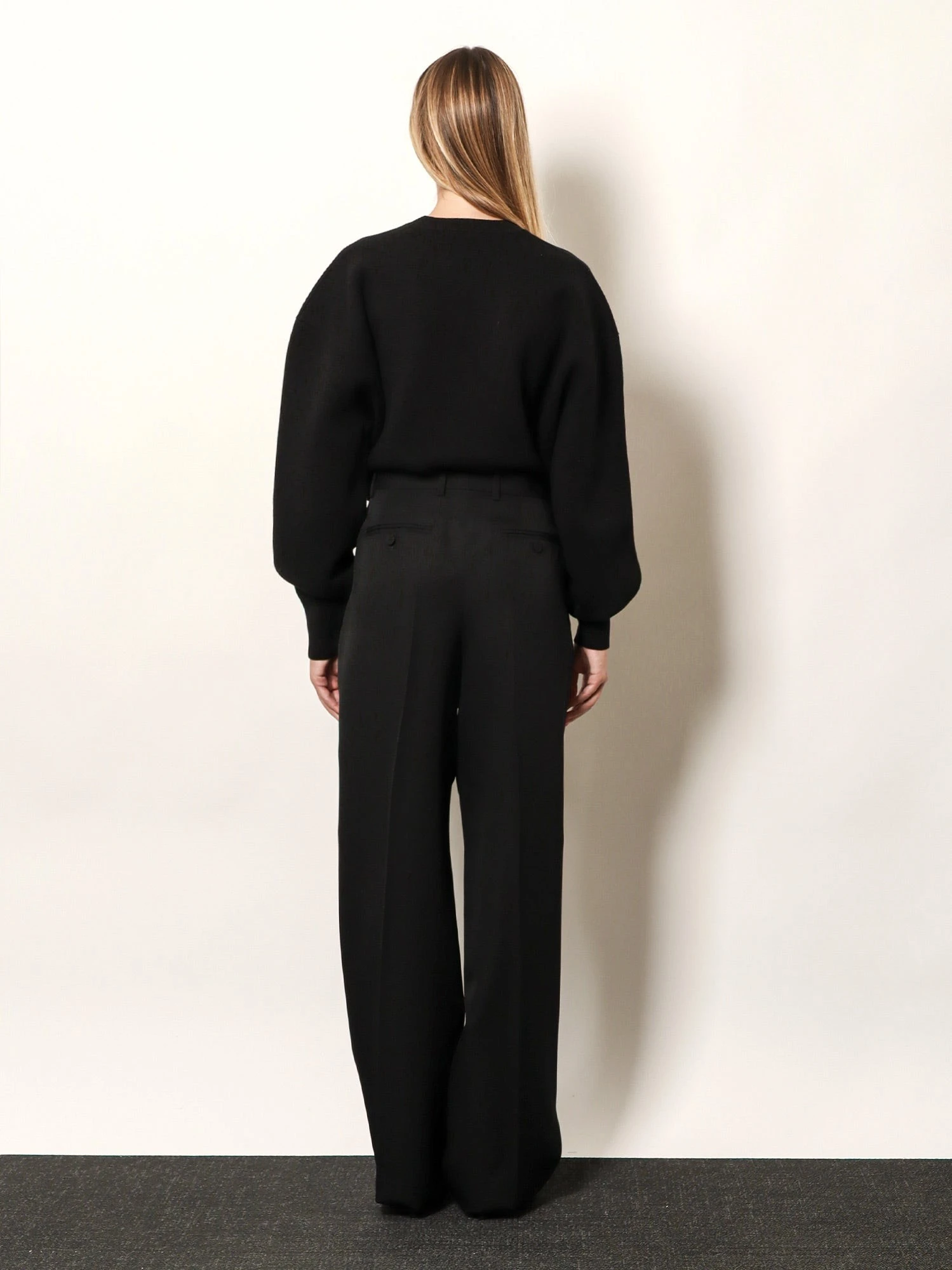 Pleated wool trousers.webp