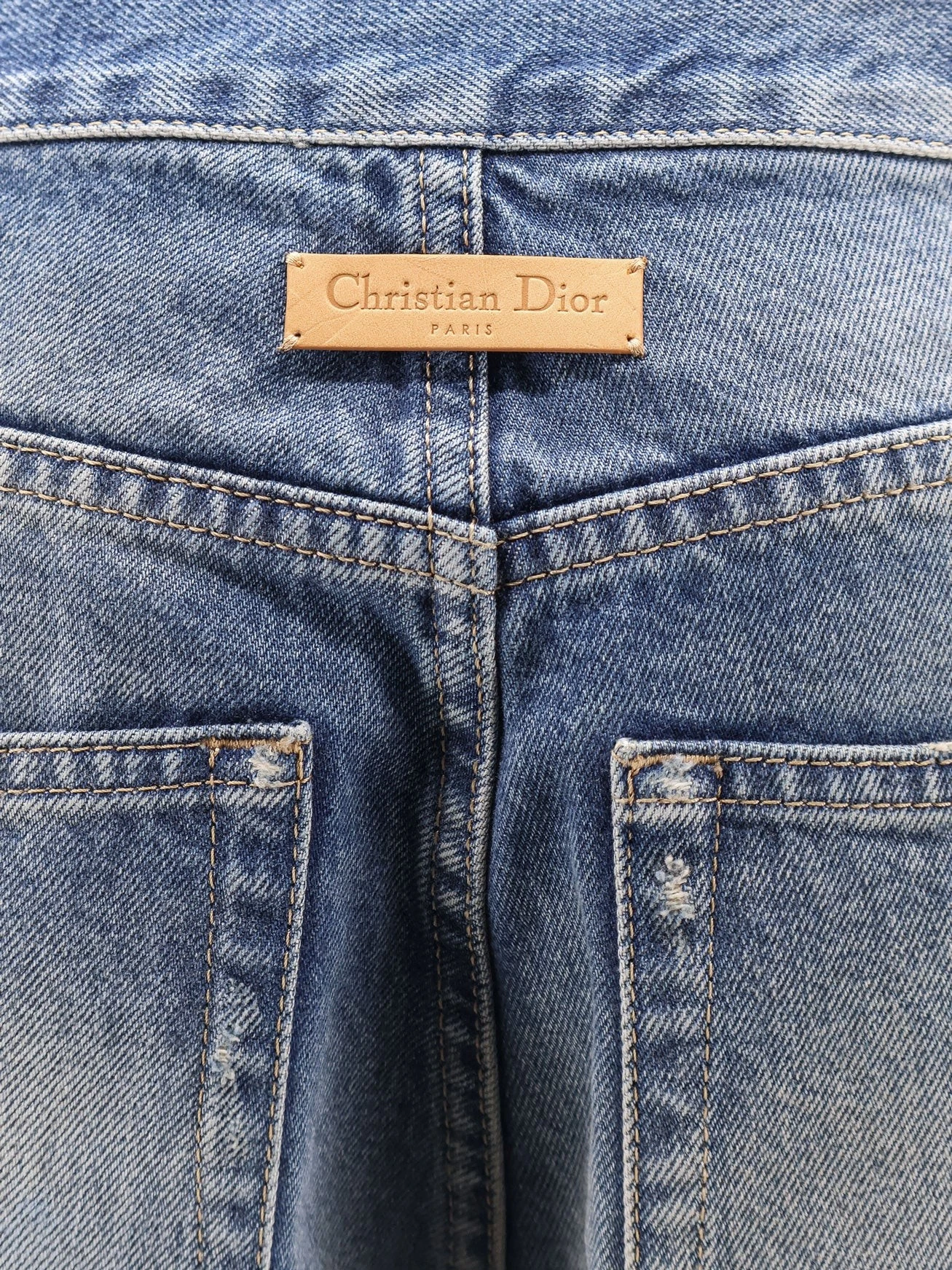 Flared Jeans with destroyed effect.webp