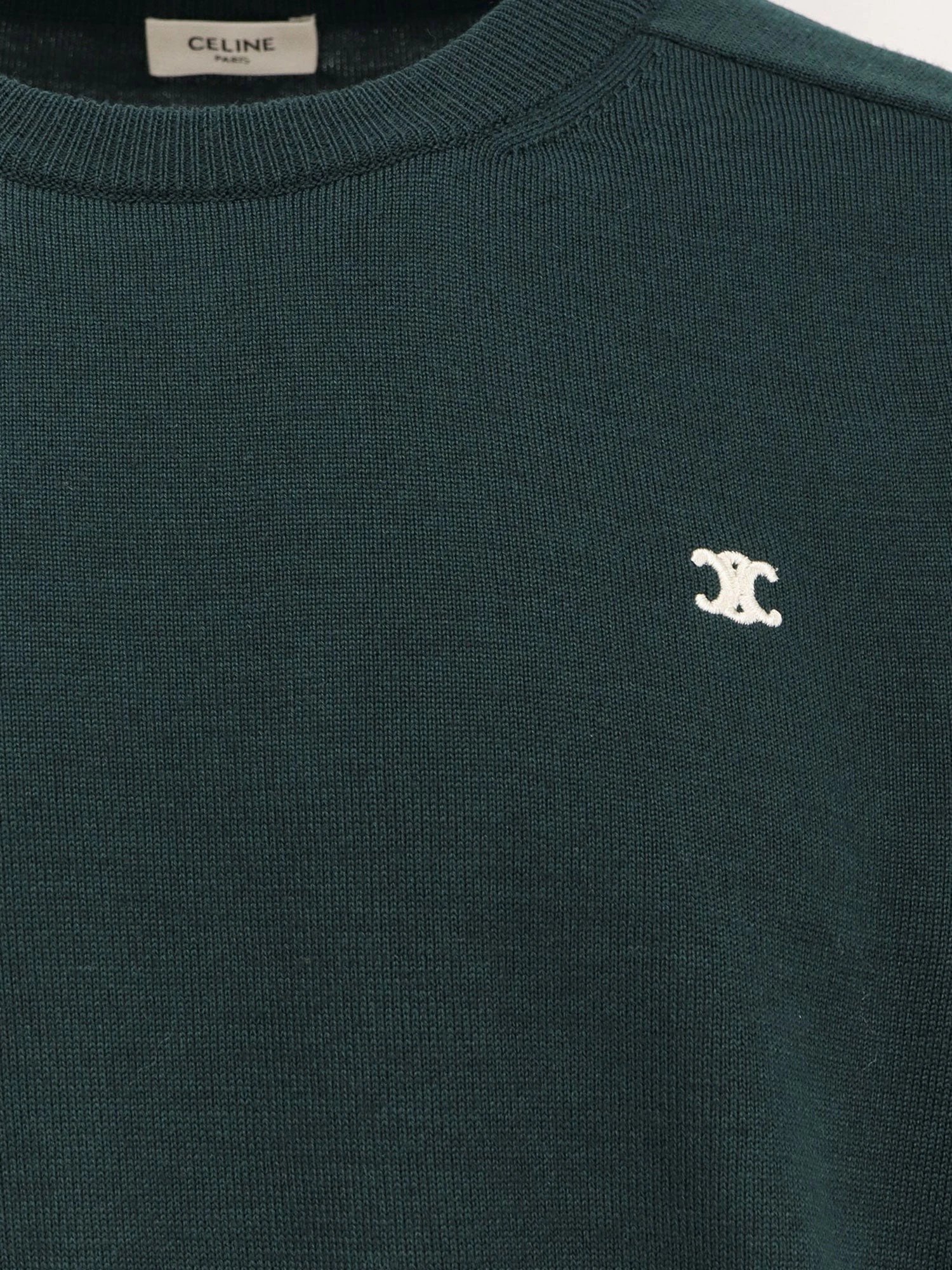 Wool sweater with embroidered logo on the front.webp