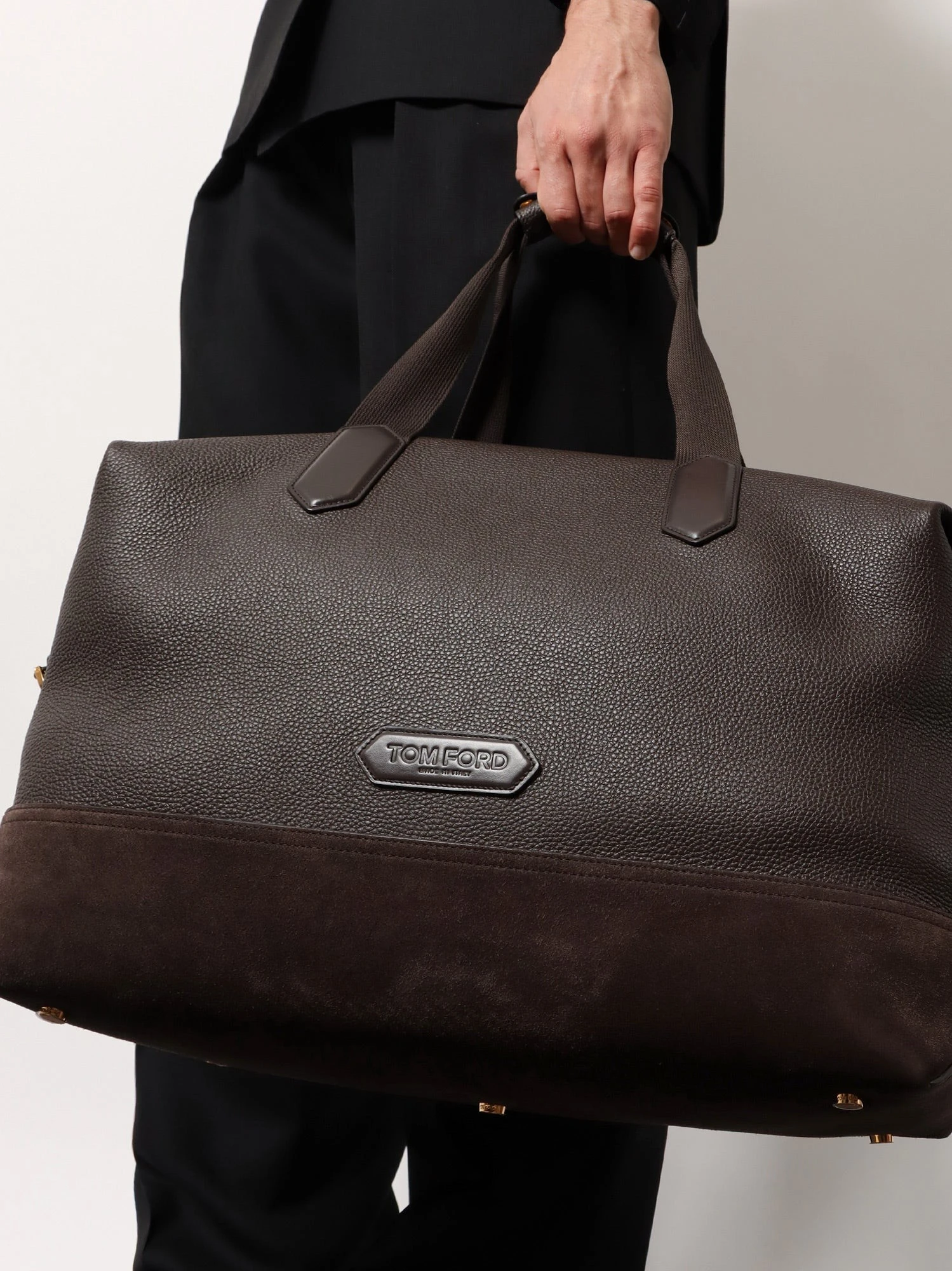 Leather travel bag with suede inserts.webp