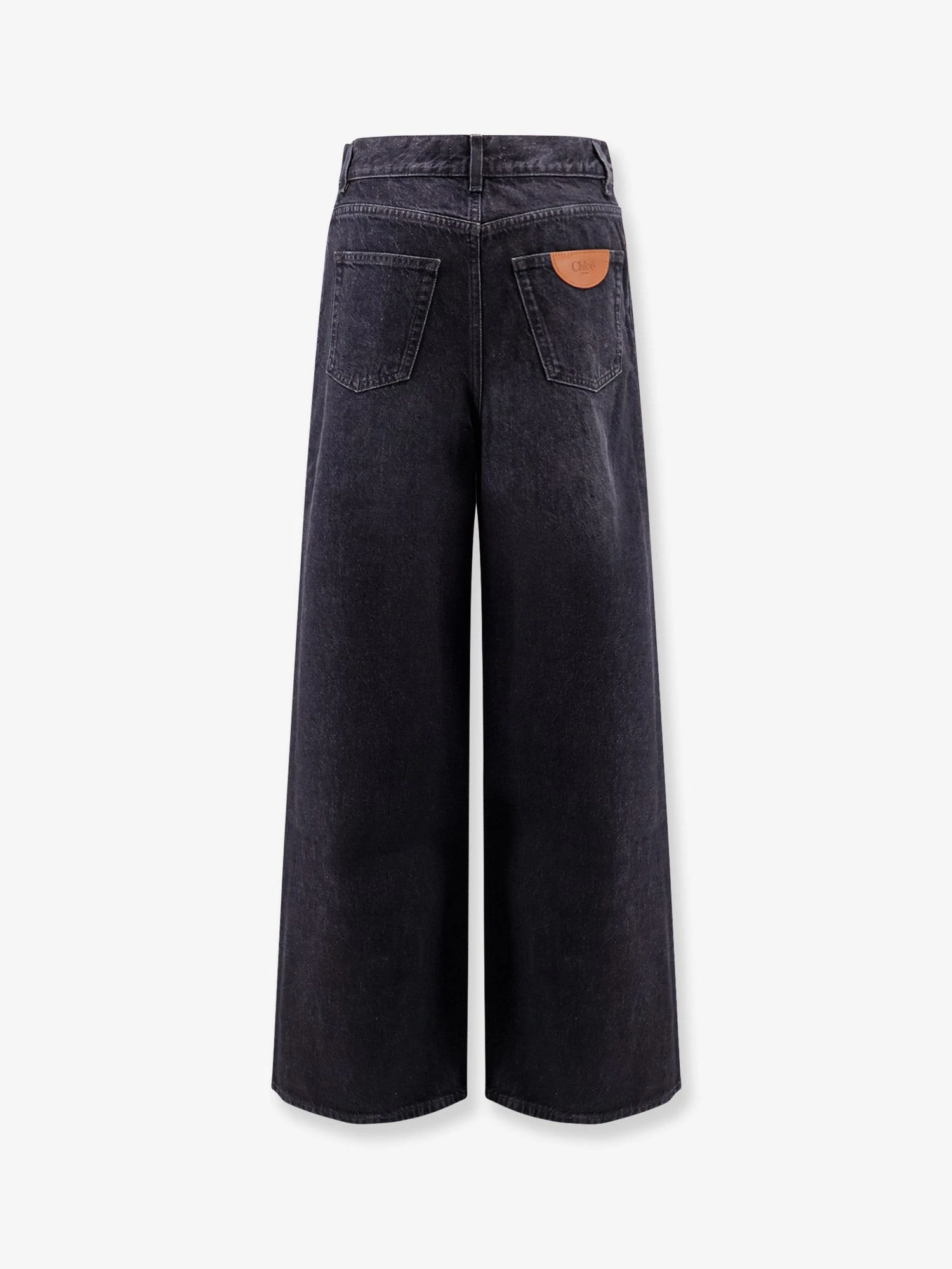 Jeans with iconic leather logo tag.webp