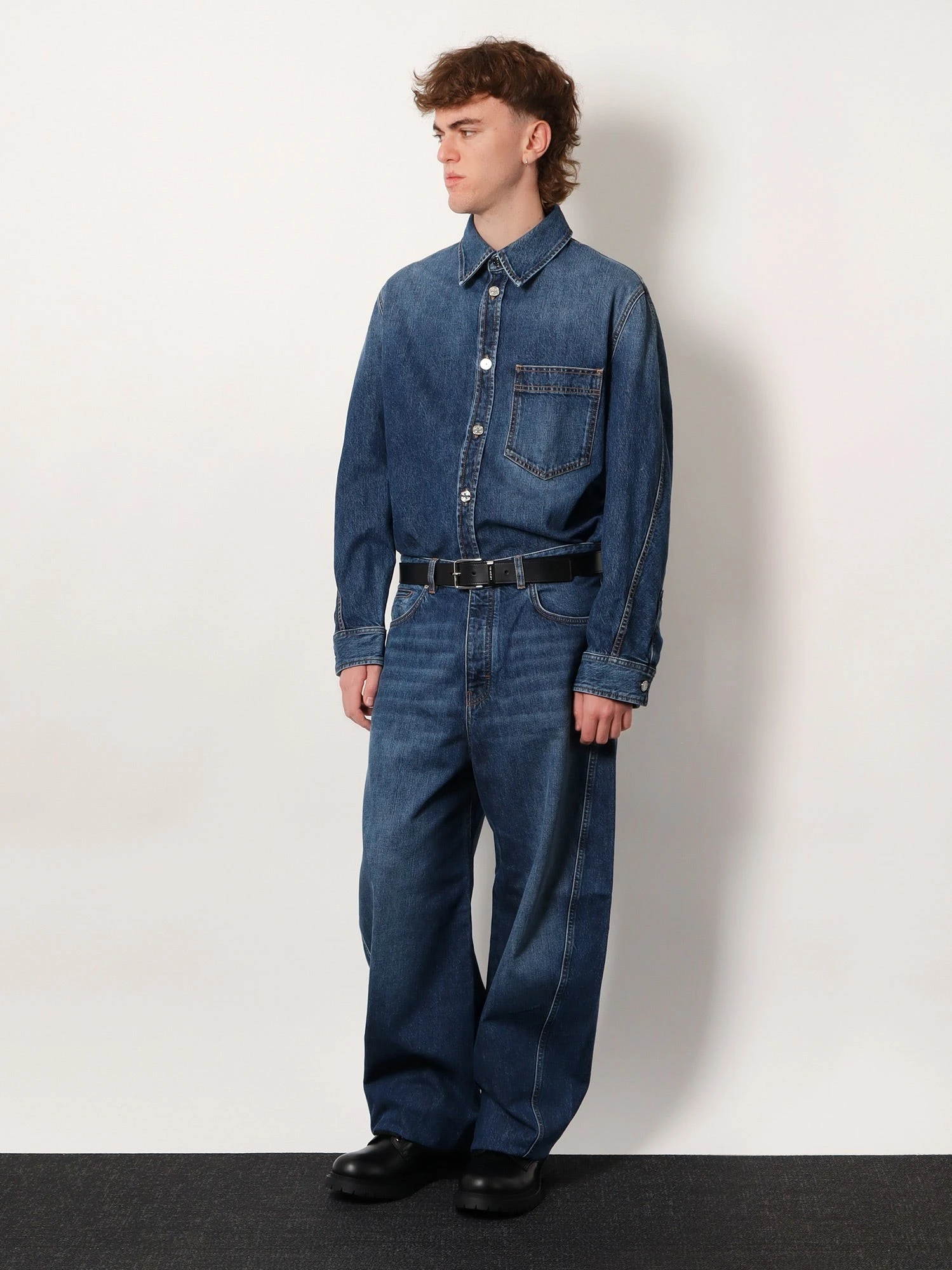 Twisted stone-washed denim jeans.webp