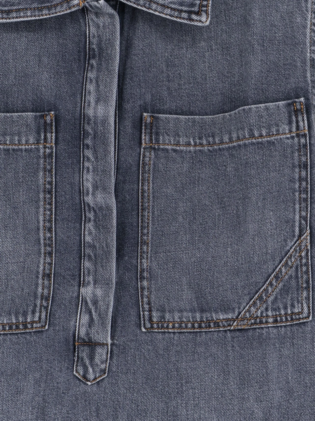 Denim shirt with frayed edges.webp
