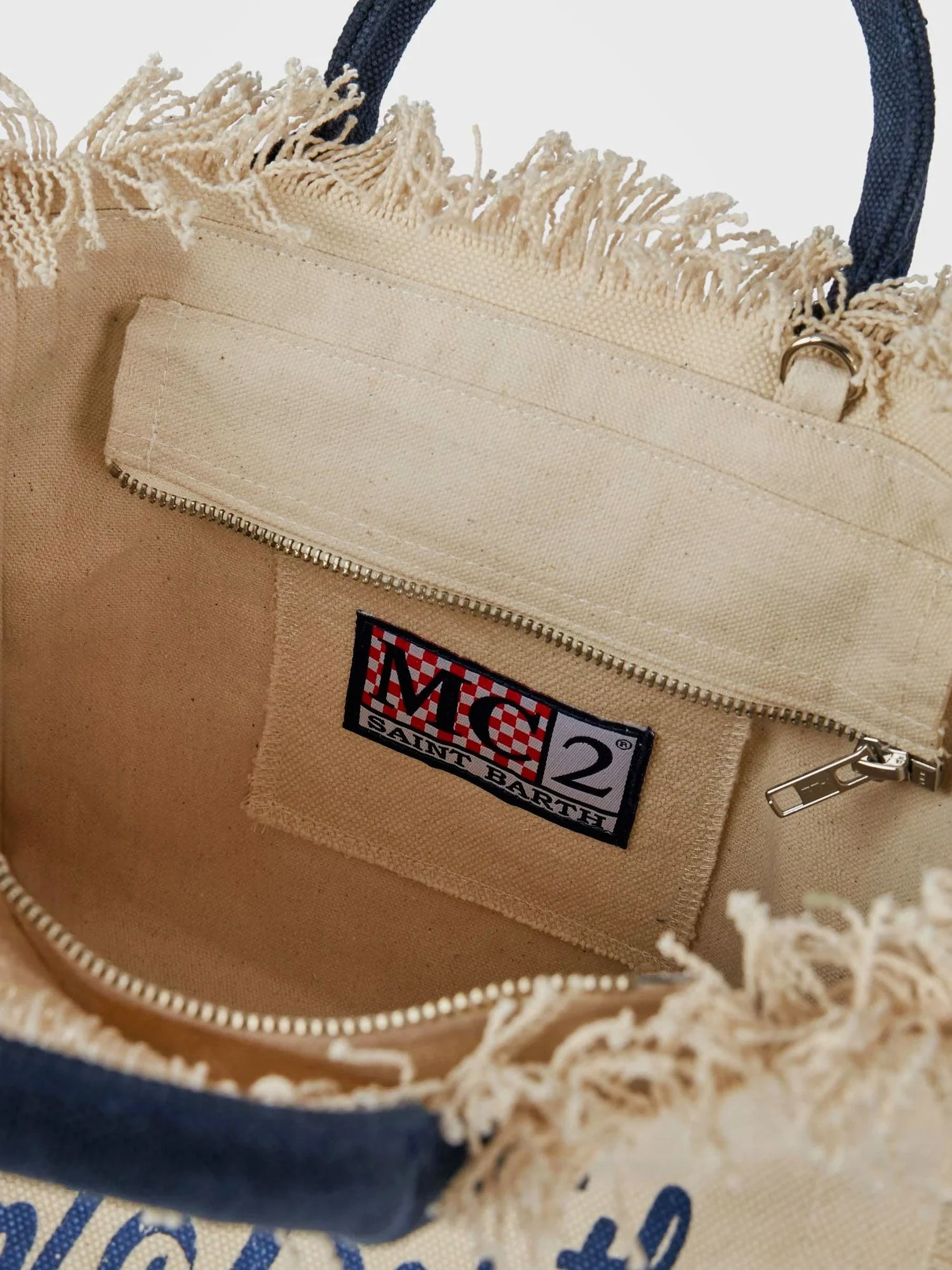 Colette canvas crossbody bag with logo print on the front.webp