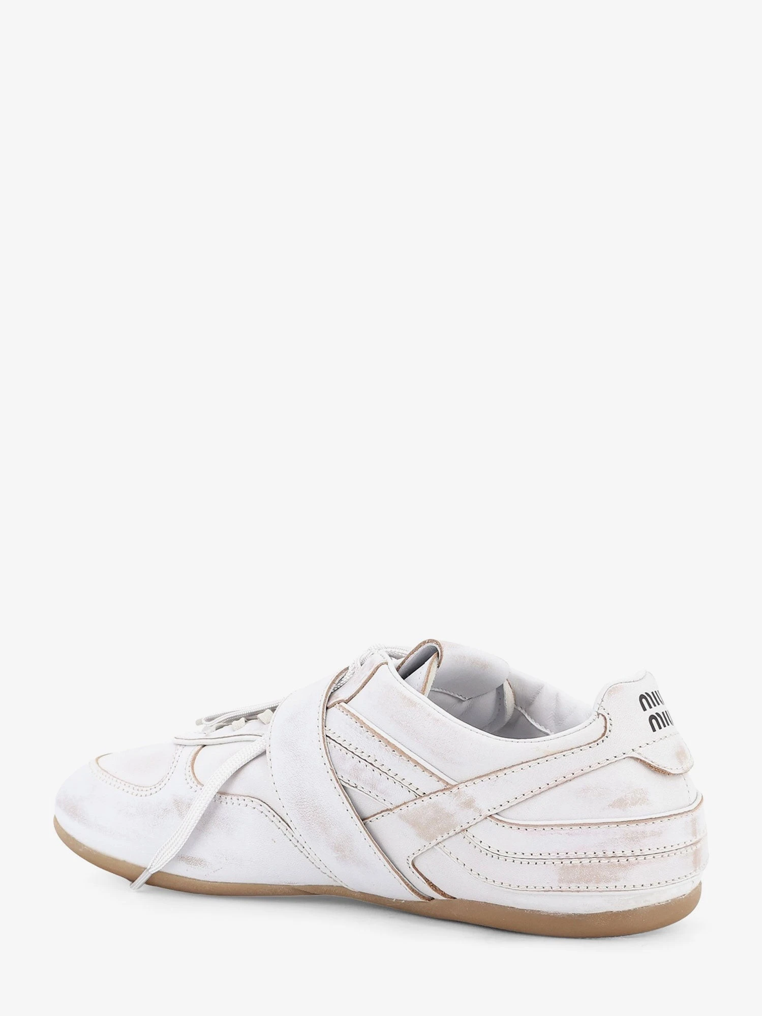 Used-effect leather sneakers with metal buckle detail.webp