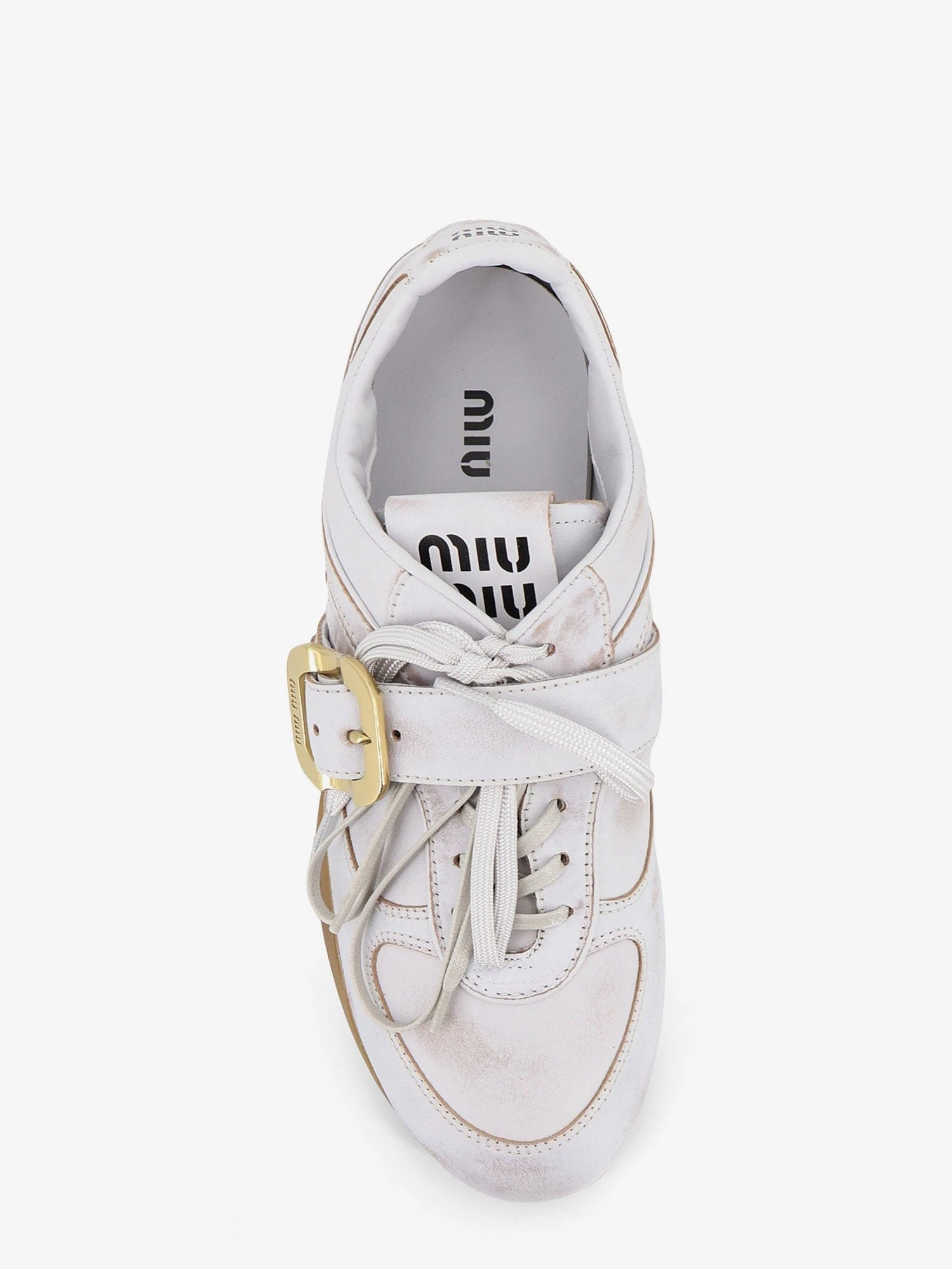 Used-effect leather sneakers with metal buckle detail.webp