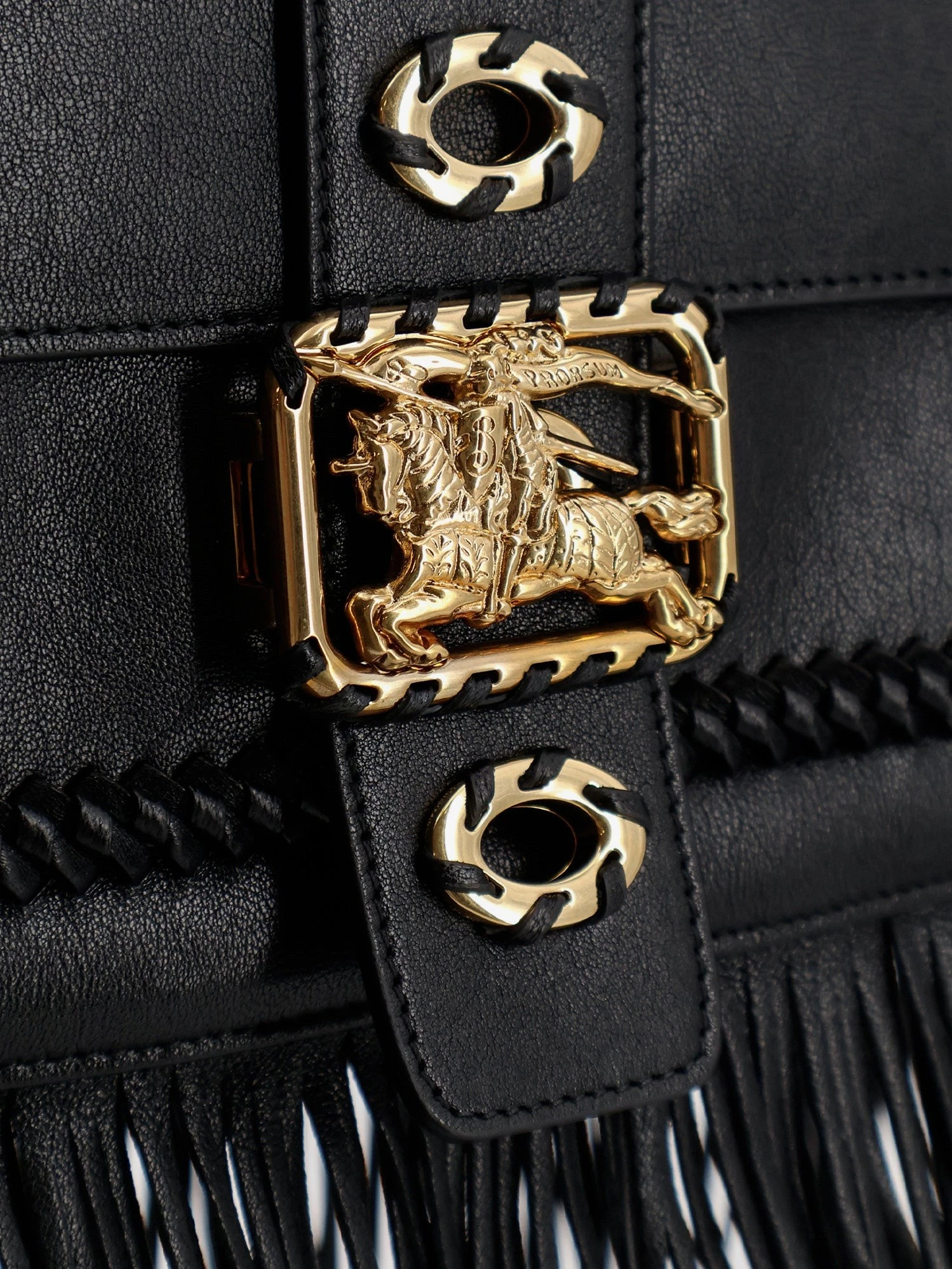 Rider leather shoulder bag with fringed edges.webp