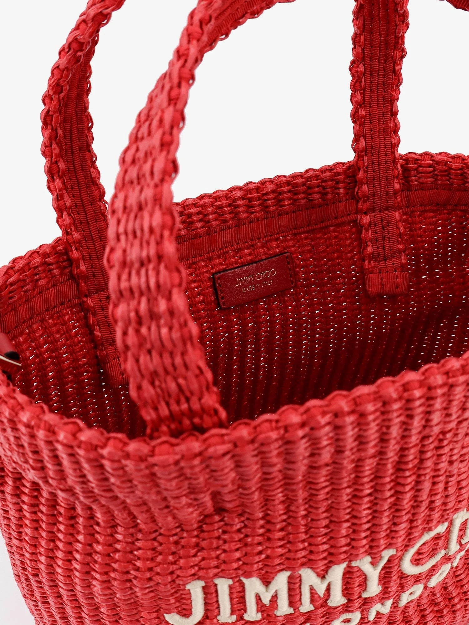 Raffia crossbody bag with embroidered logo on the front.webp